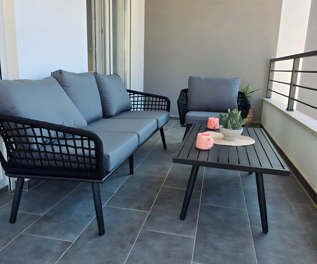 Balcony seating with grey cushions