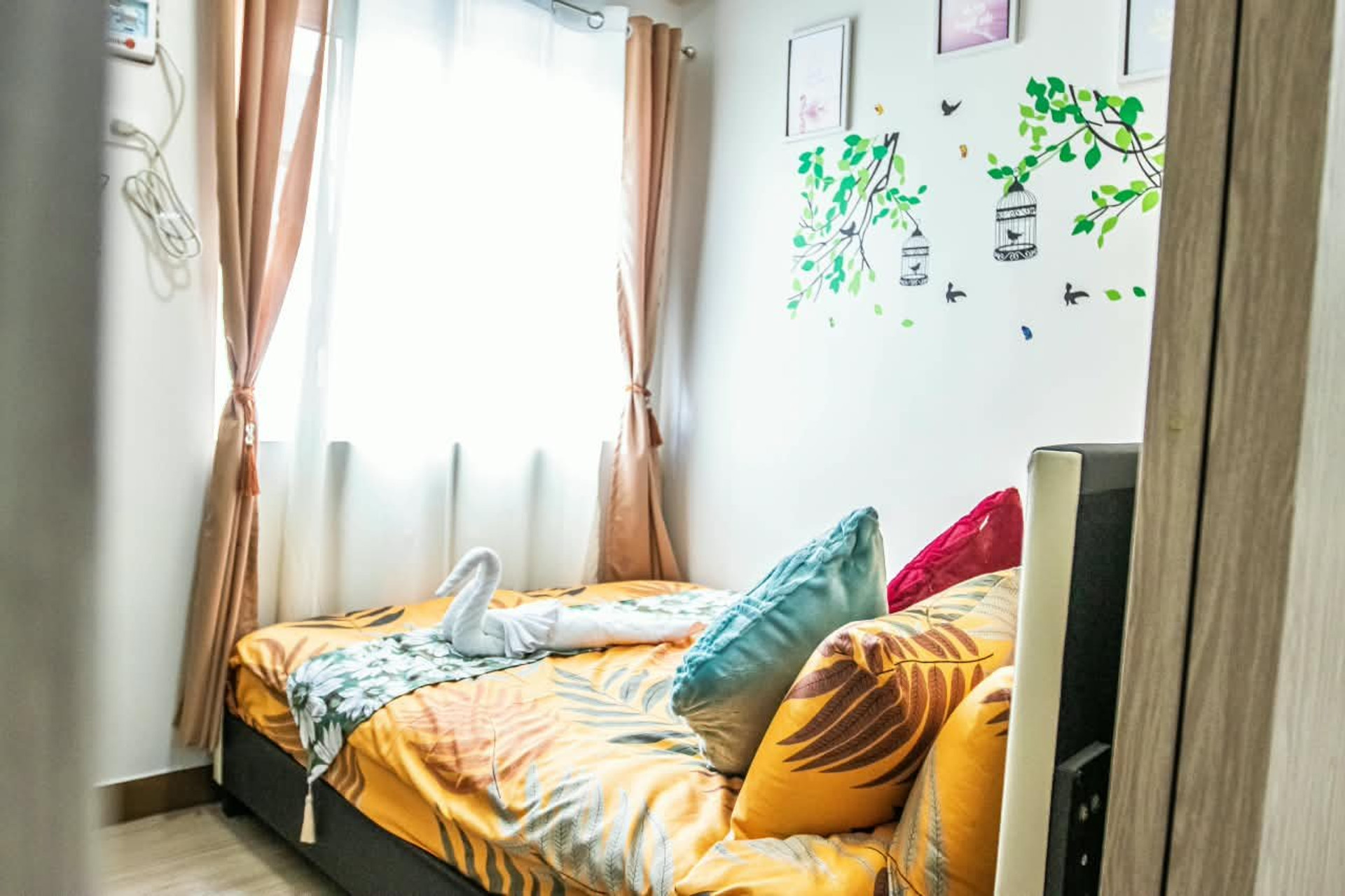 Cozy bedroom with decorated bed