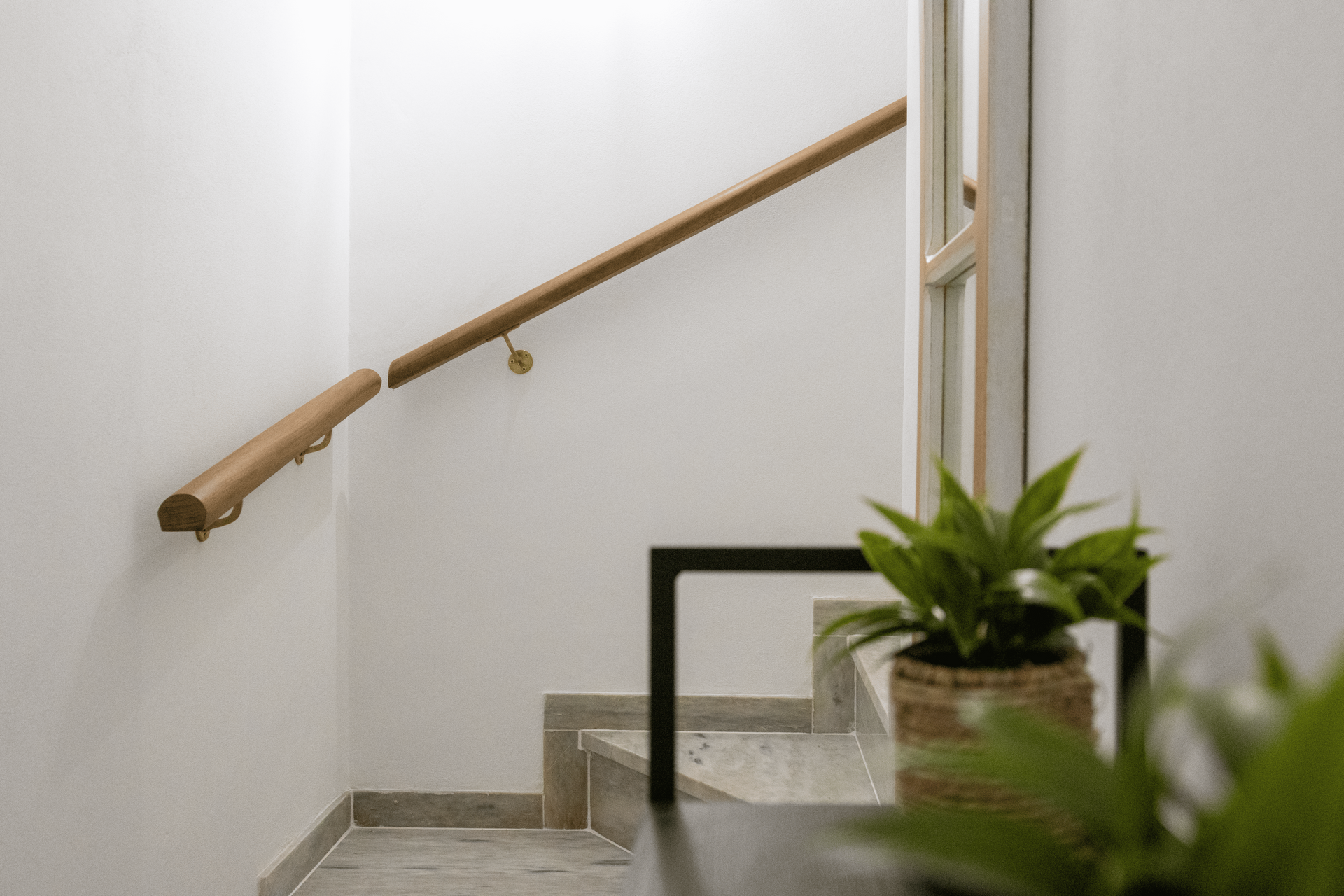 Staircase with wooden handrail