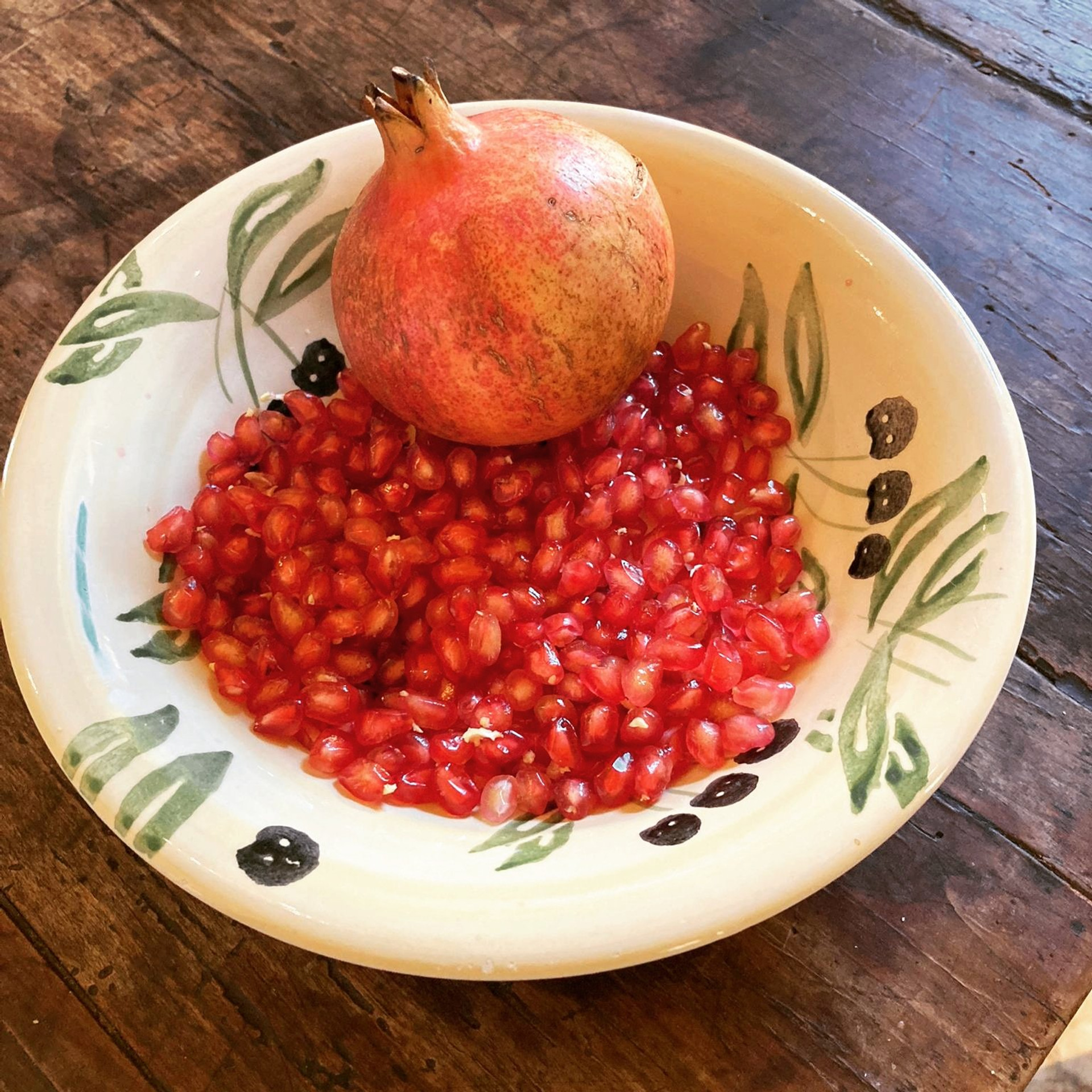 Pomegranate in decorative bowl