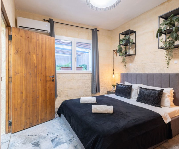 Stone bedroom with double bed