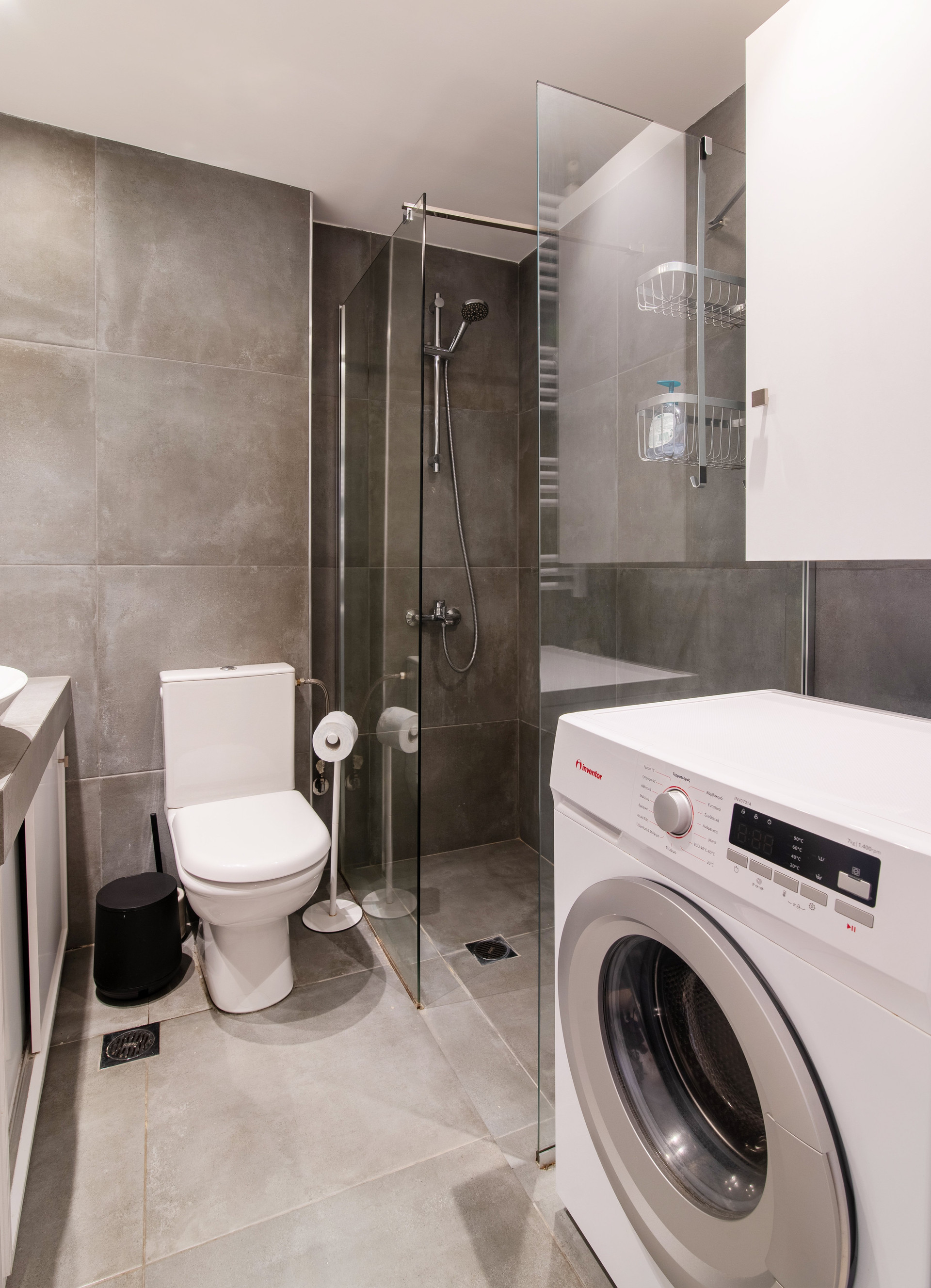 Bathroom with shower and washer