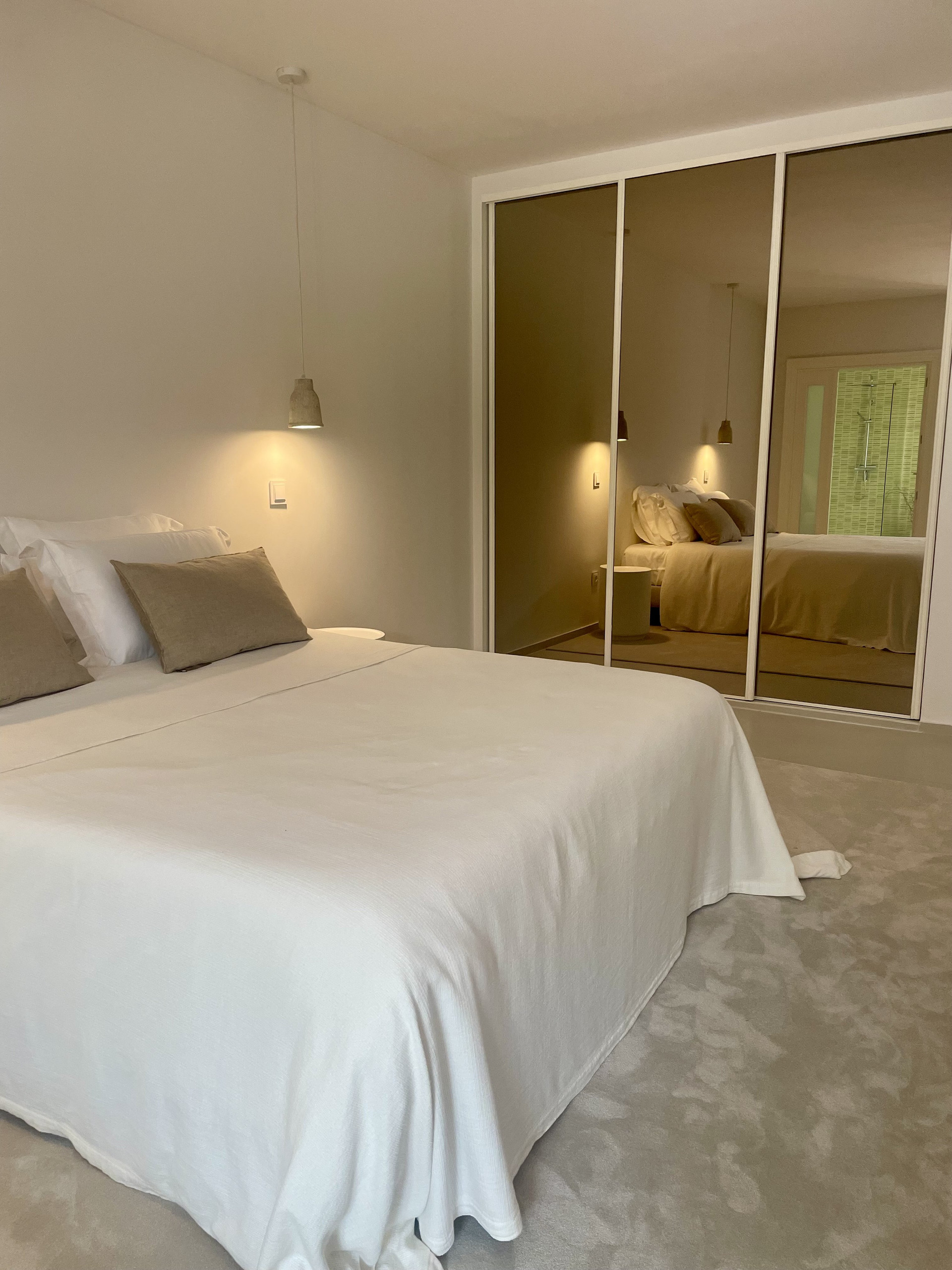Spacious bedroom with queen-size bed and peaceful atmosphere