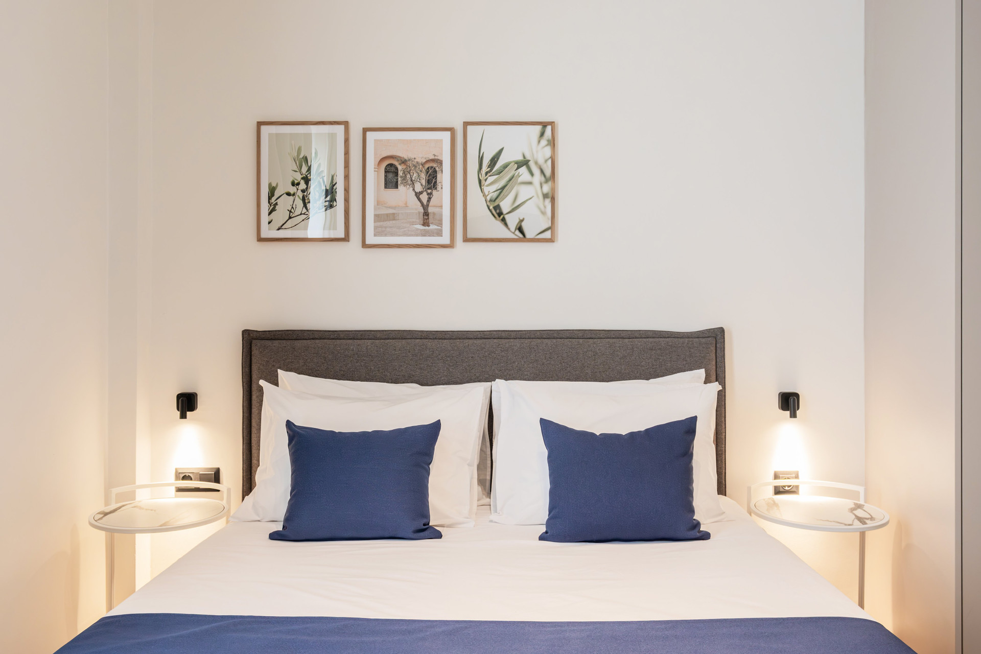 Double bed with blue pillows