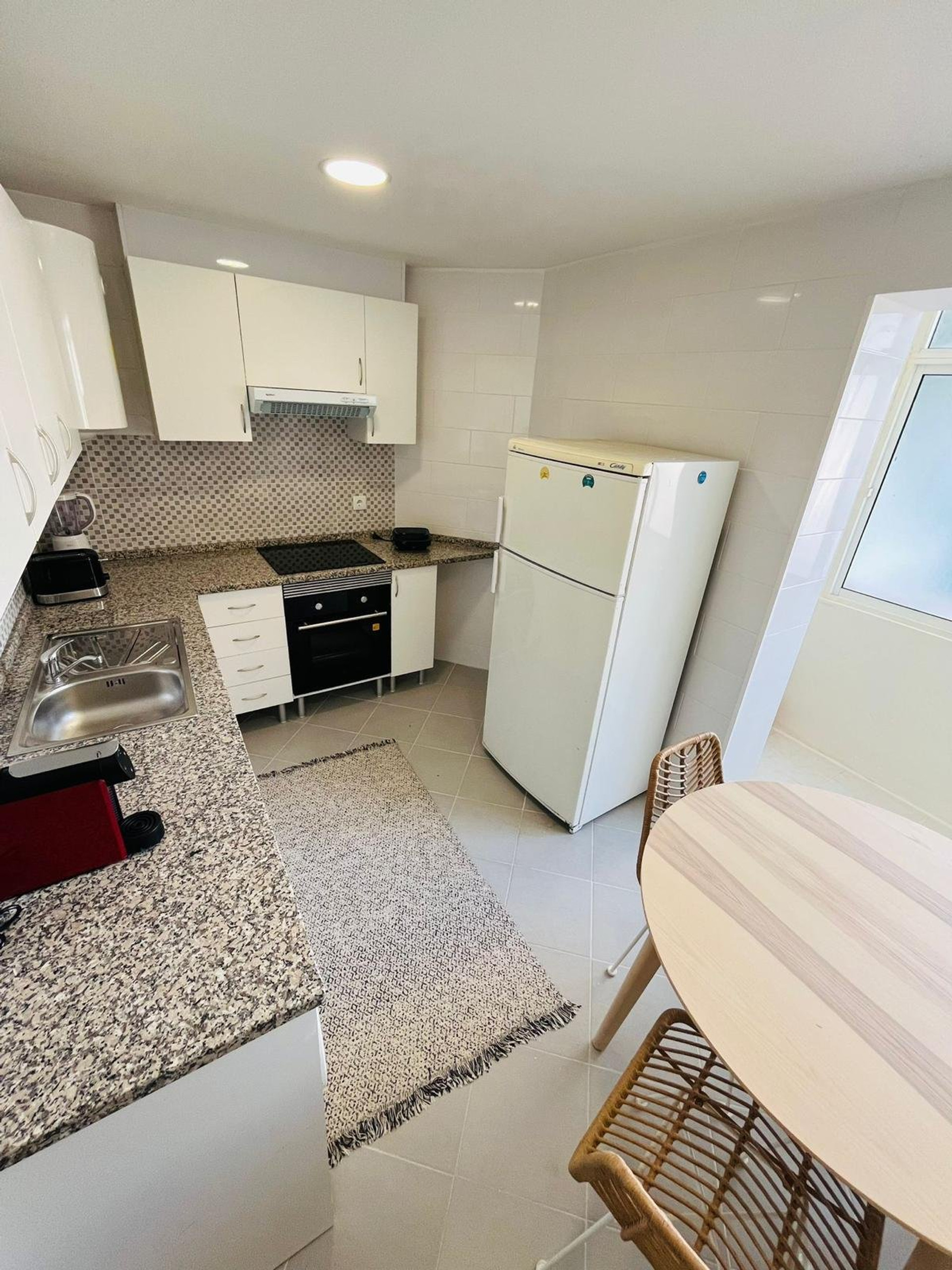 White kitchen with dining area