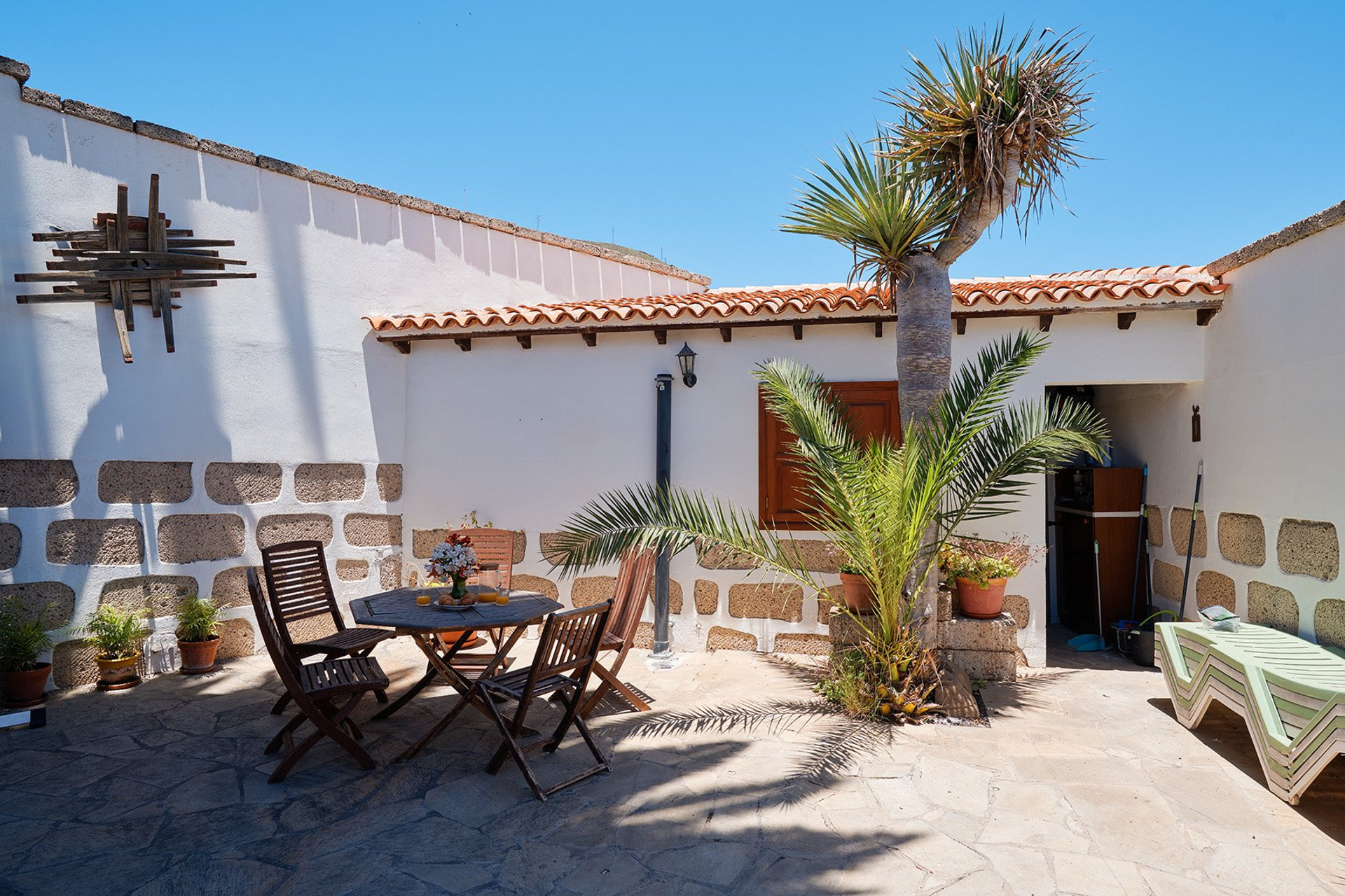 Rustic terrace with palm tree