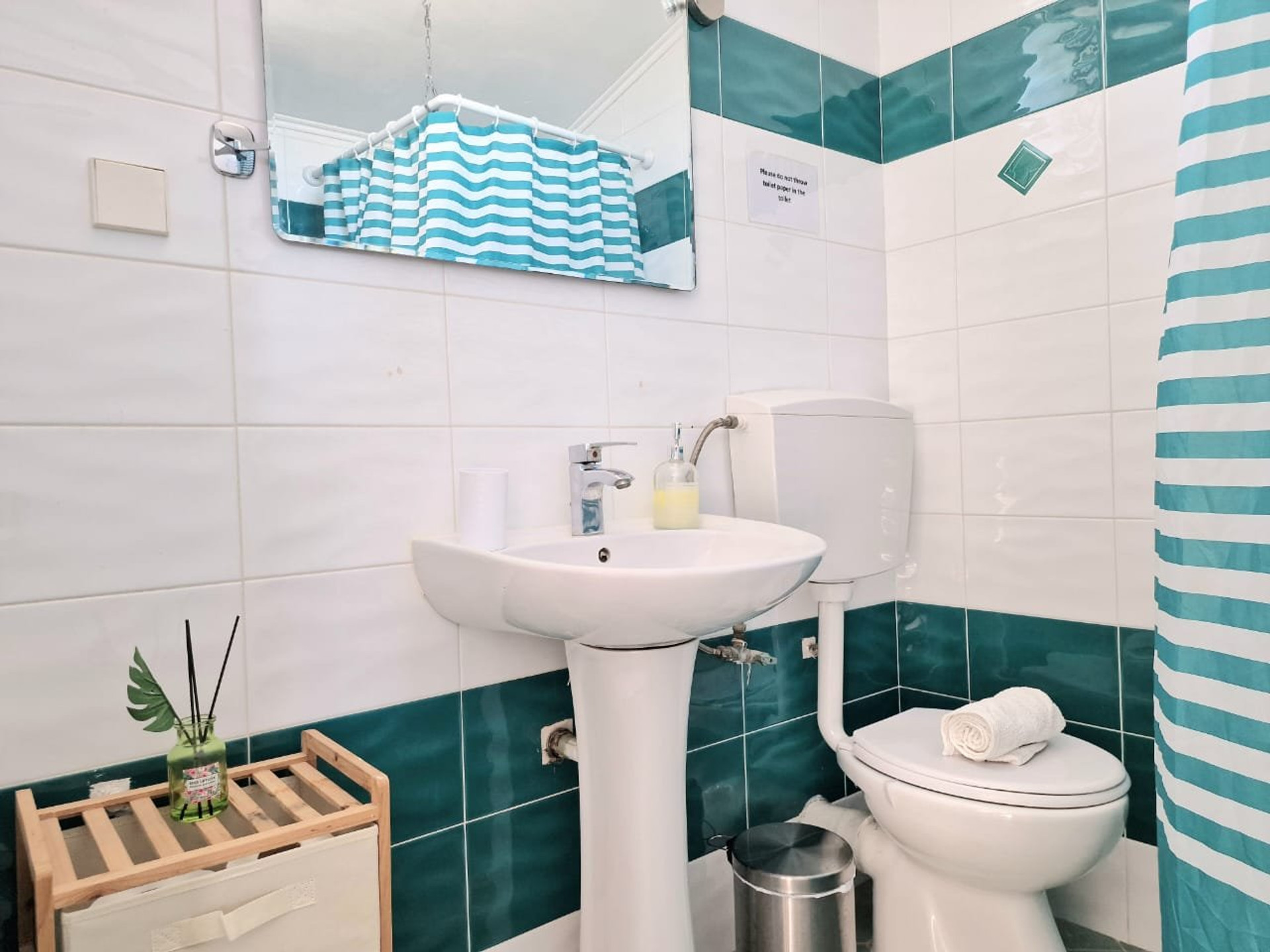 Bathroom with teal tiles