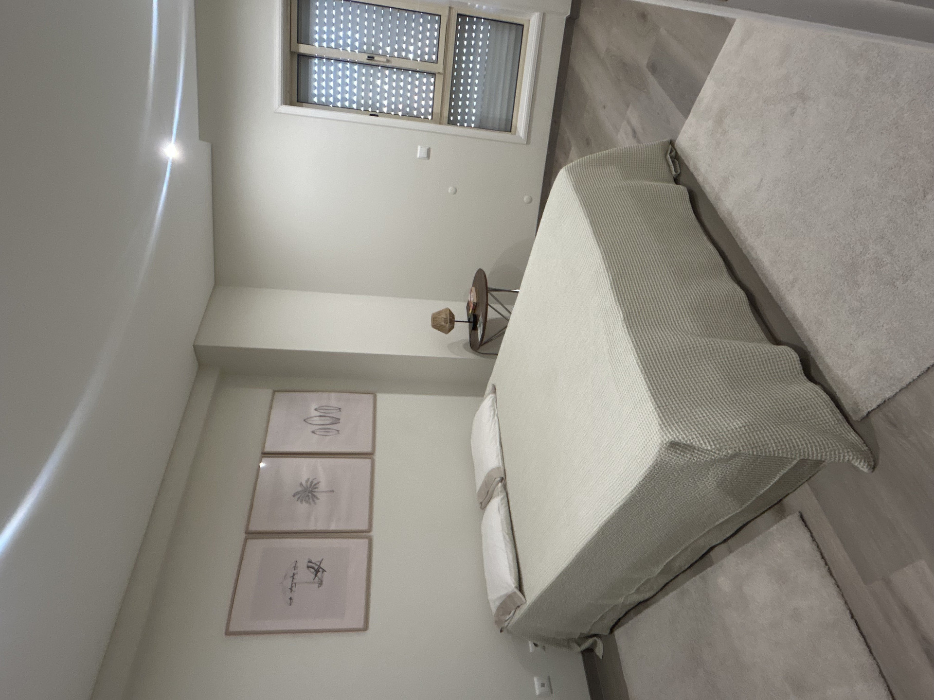 Bedroom with artwork and bed