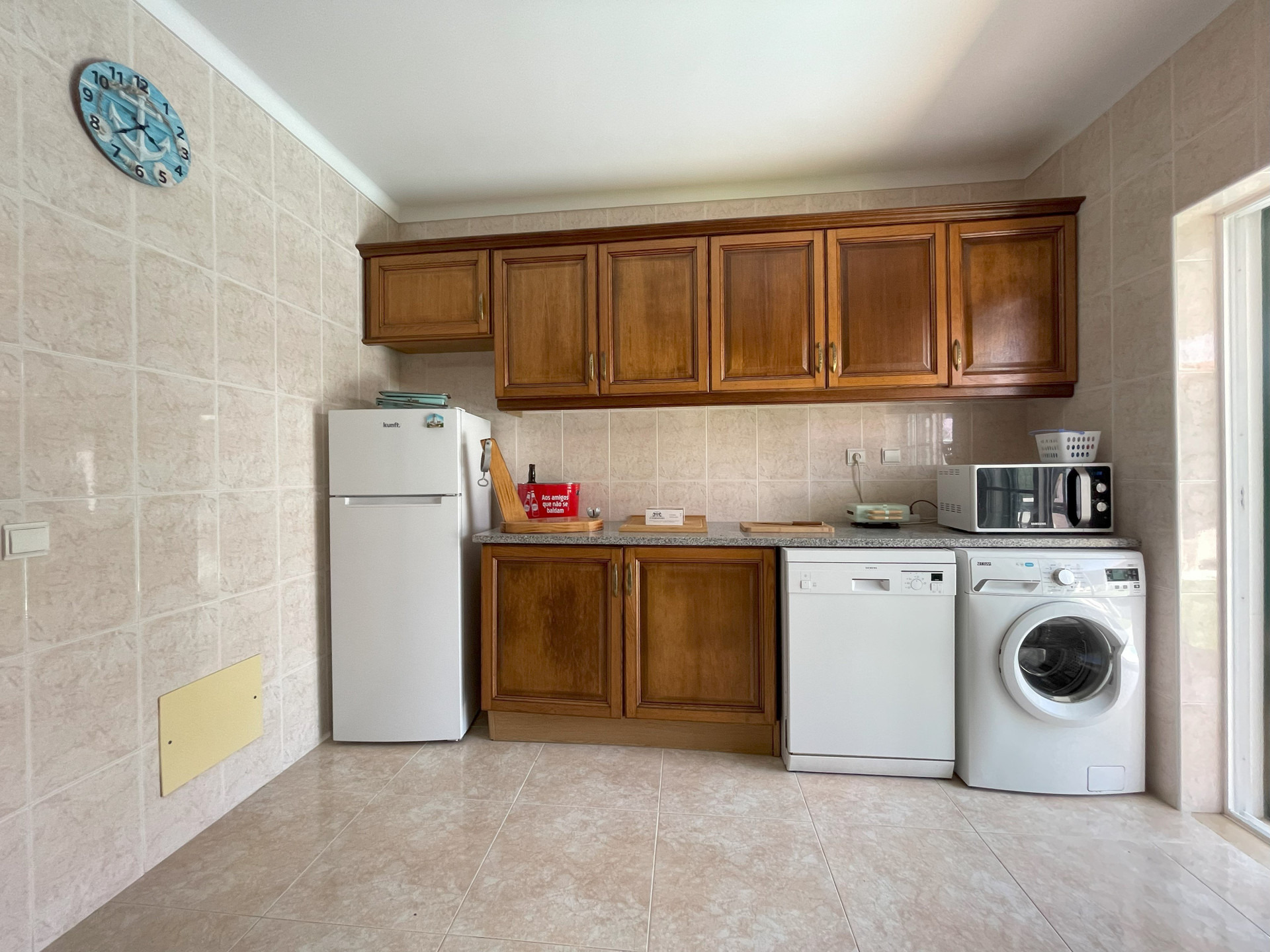 Kitchen laundry appliances area