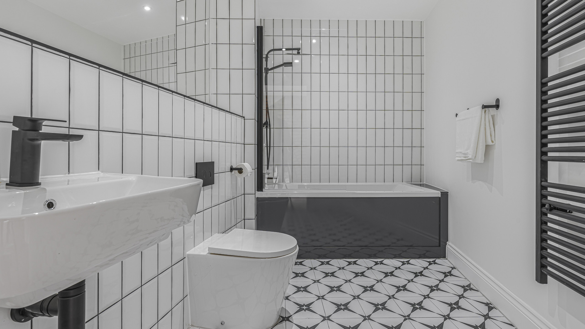 Bathroom with bathtub shower white tiles