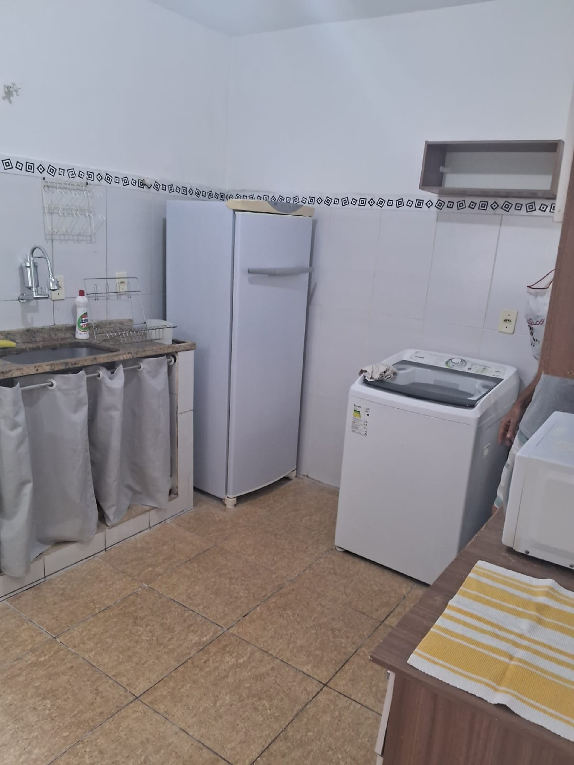Kitchen with fridge and washer