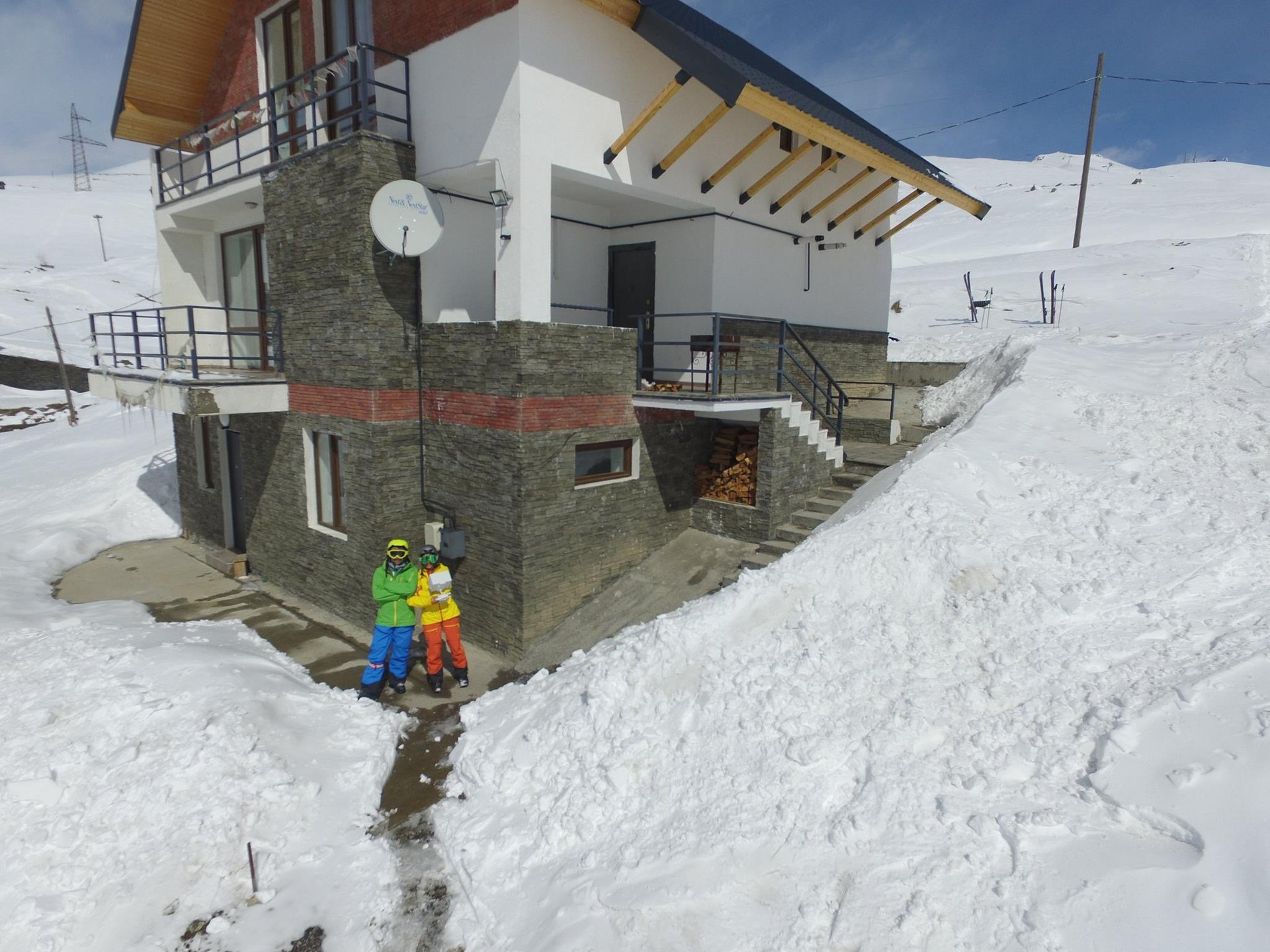 Stone chalet exterior in snow