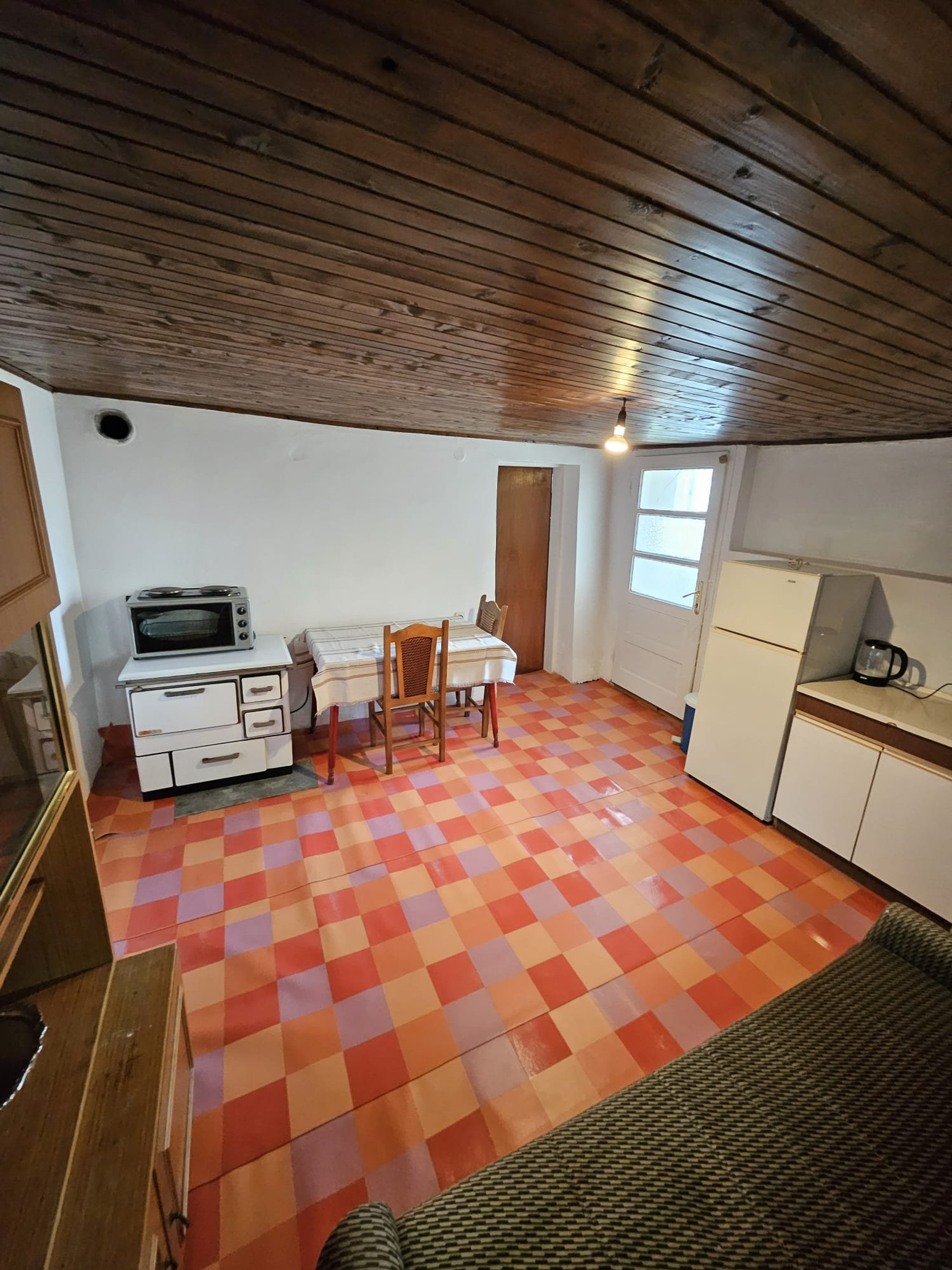 Kitchen with stove and fridge