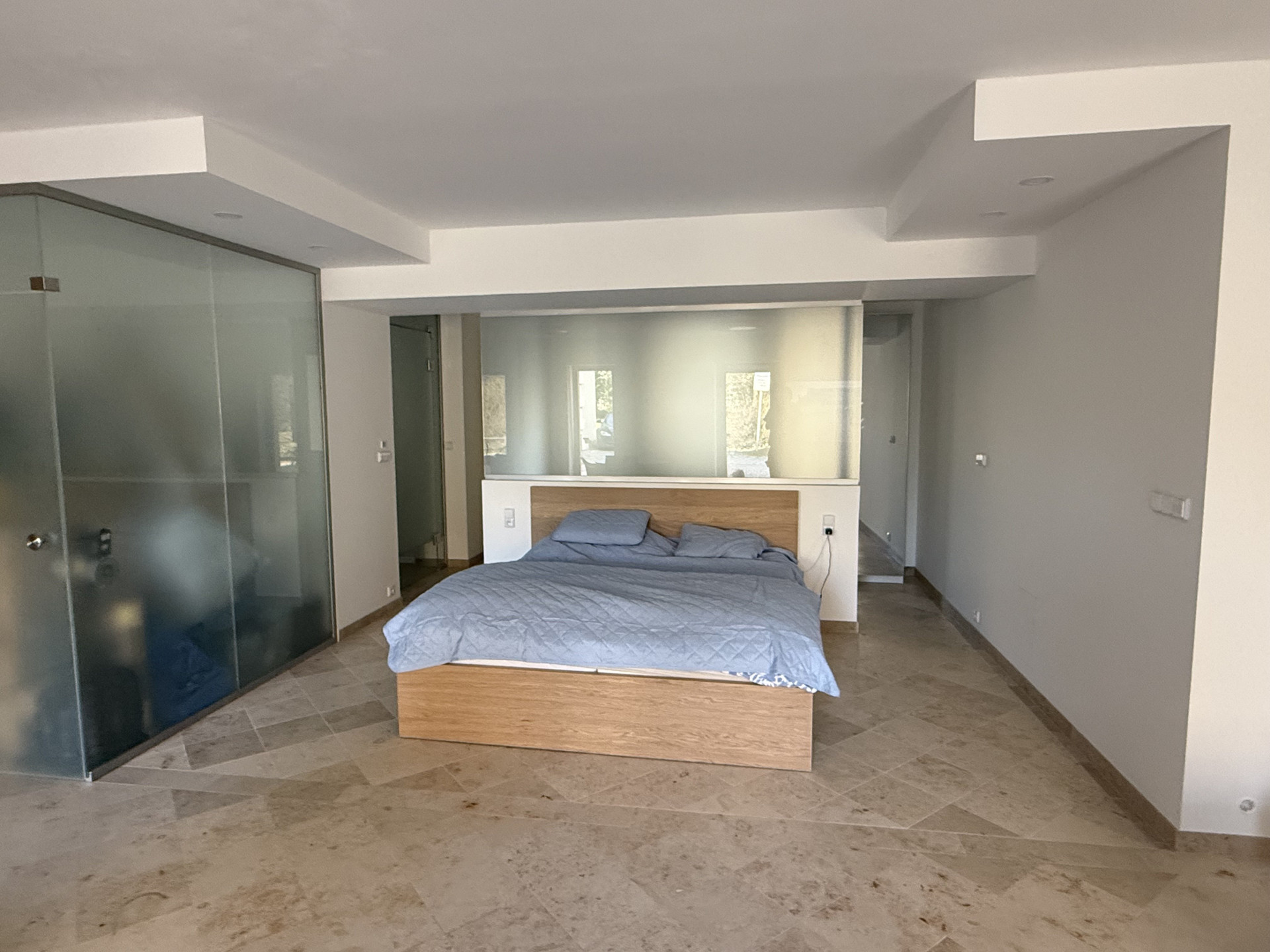 Bedroom with glass partition wall