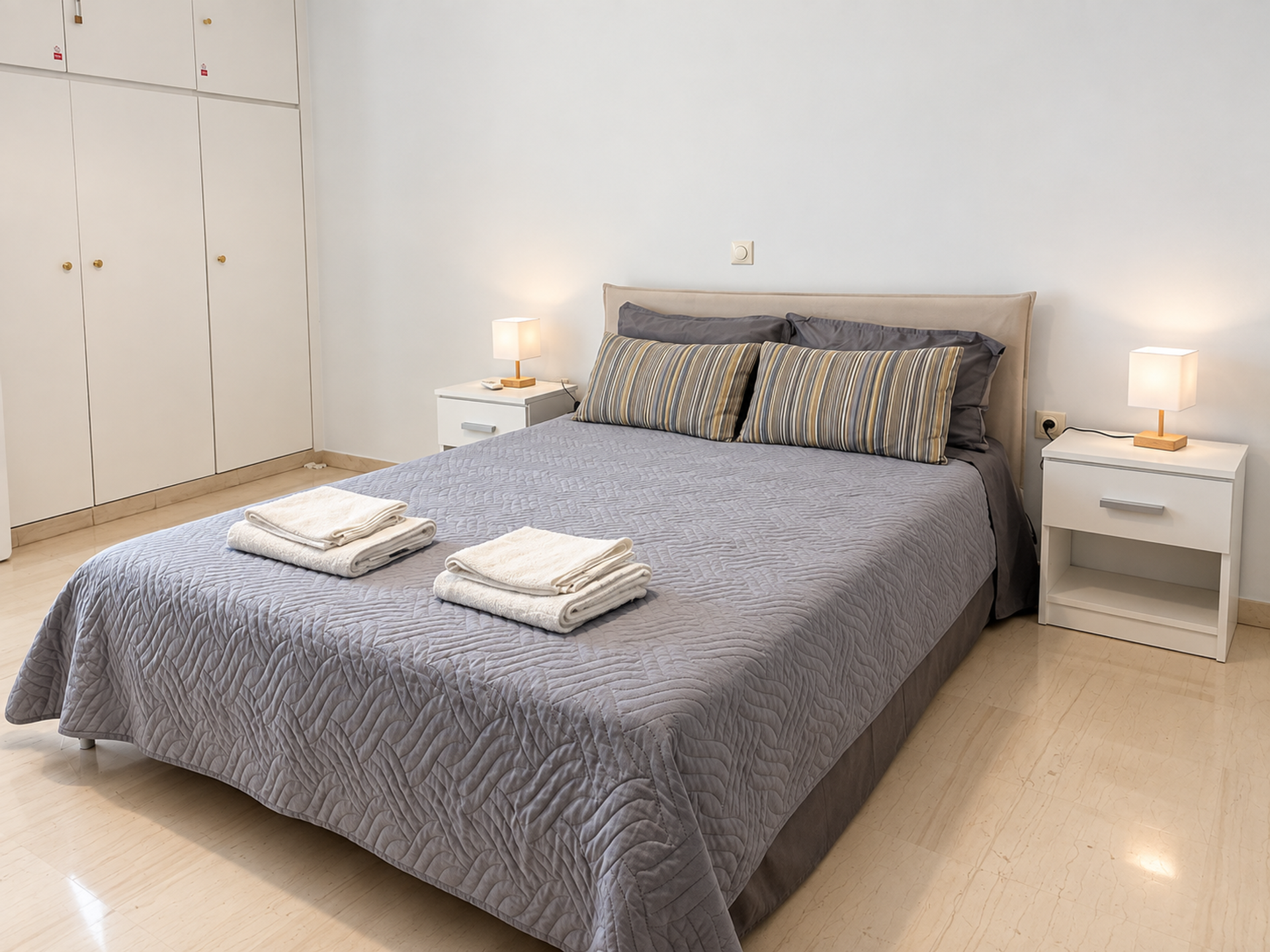 Comfortable bedroom with towels