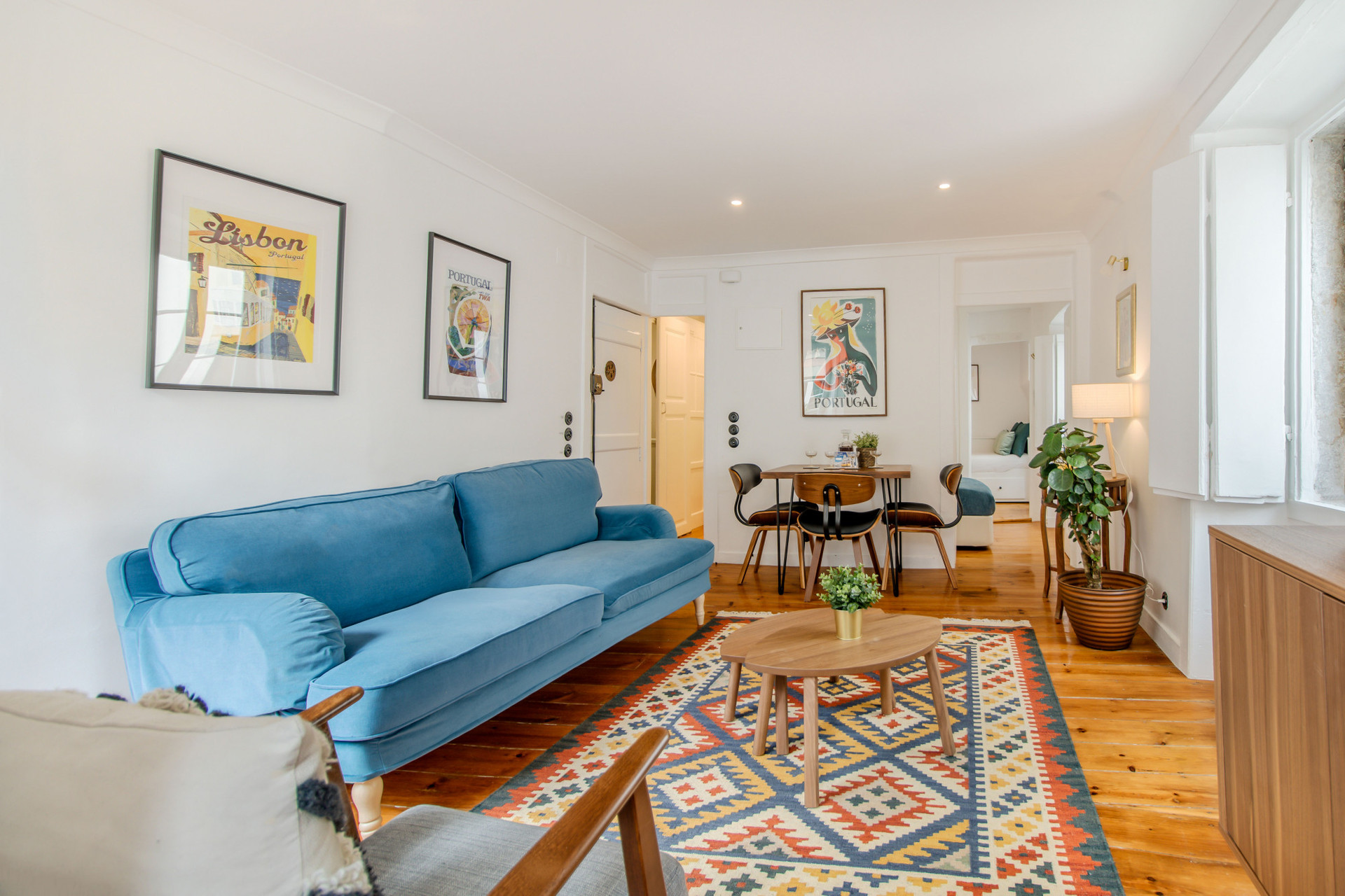 Living Room with Flat-Screen TV, tons of natural light, comfy furniture, air-conditioning and heating, beautiful art and details.