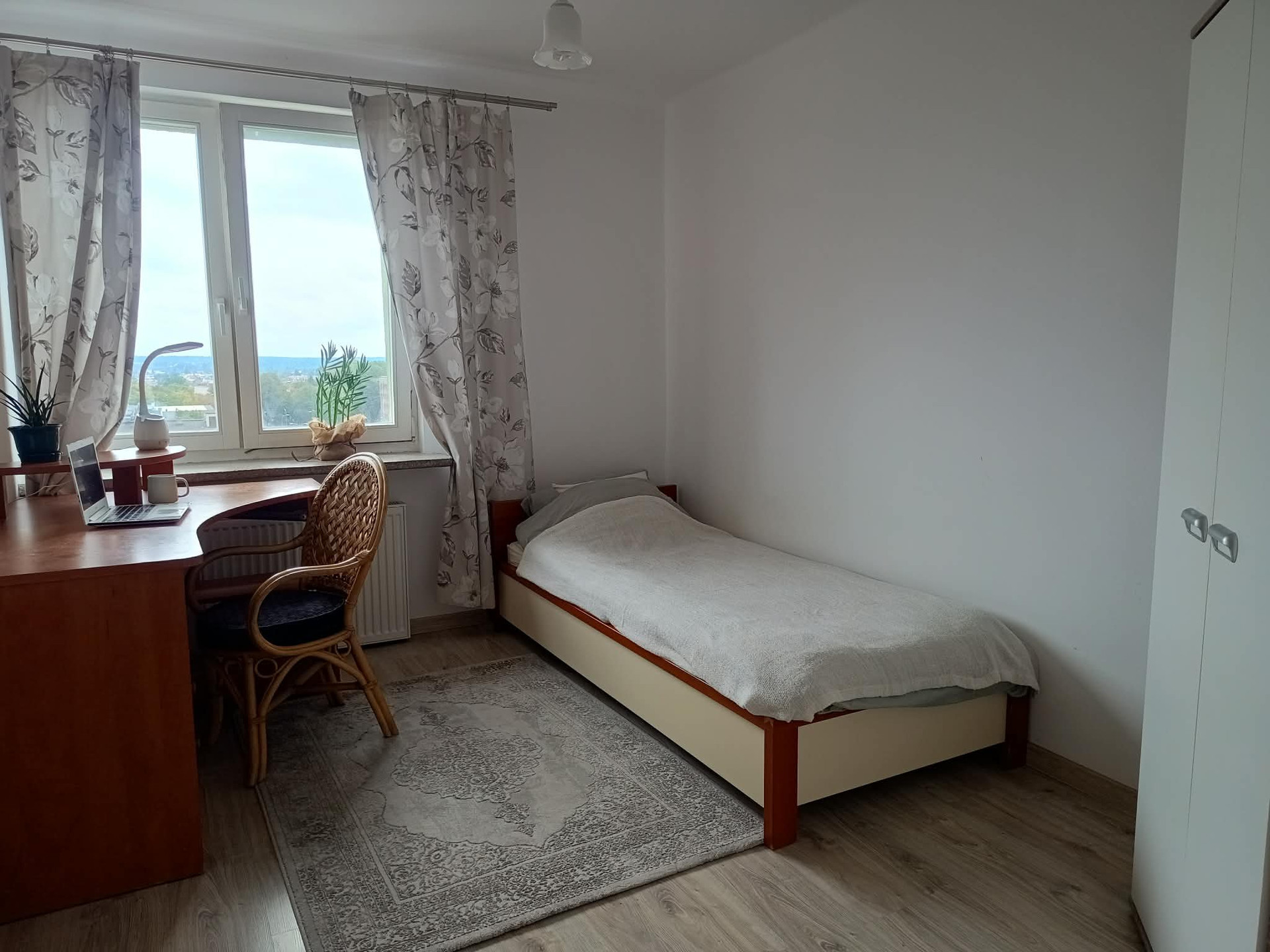 Bright bedroom with city view