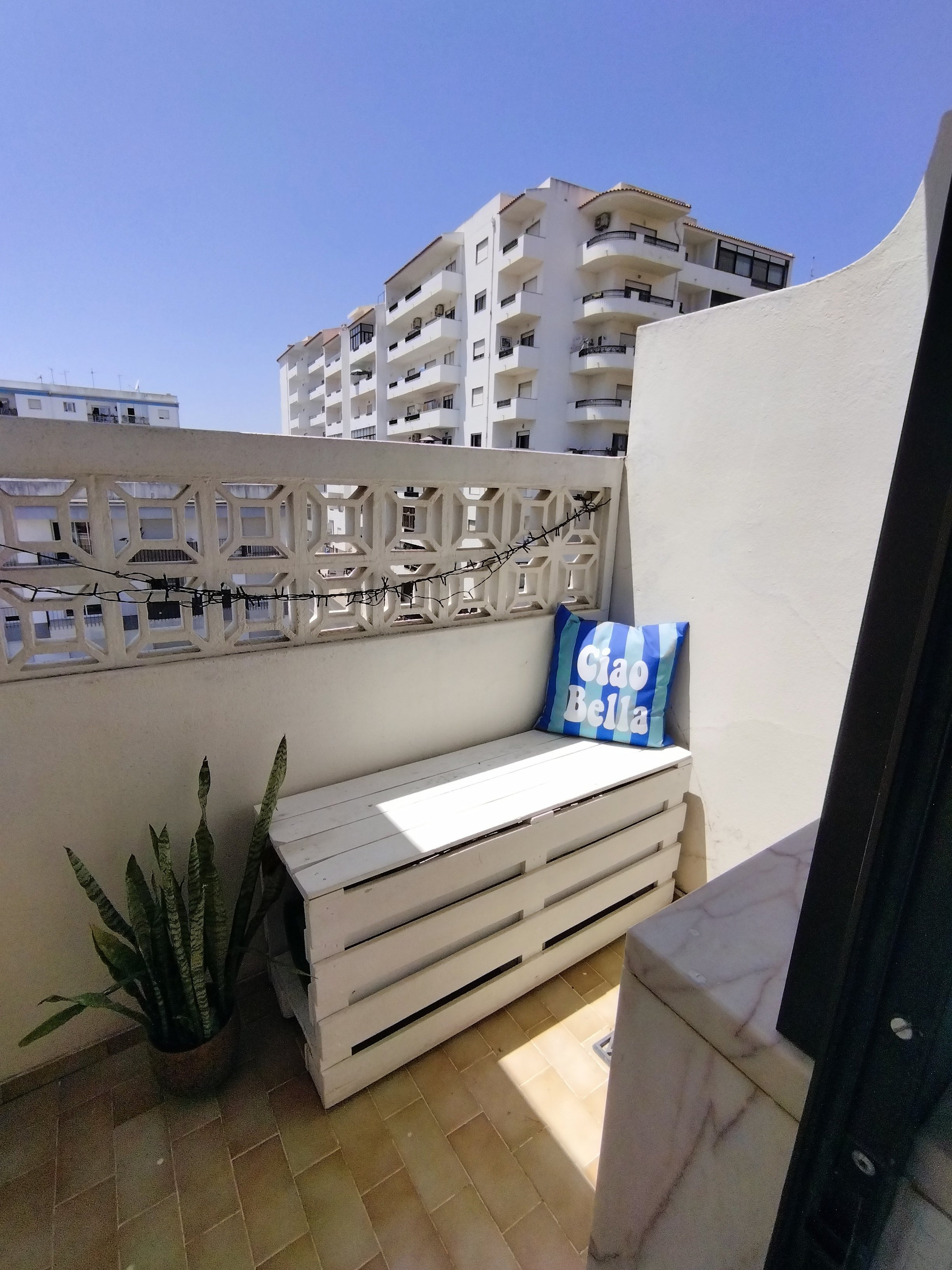 Small balcony with seating bench