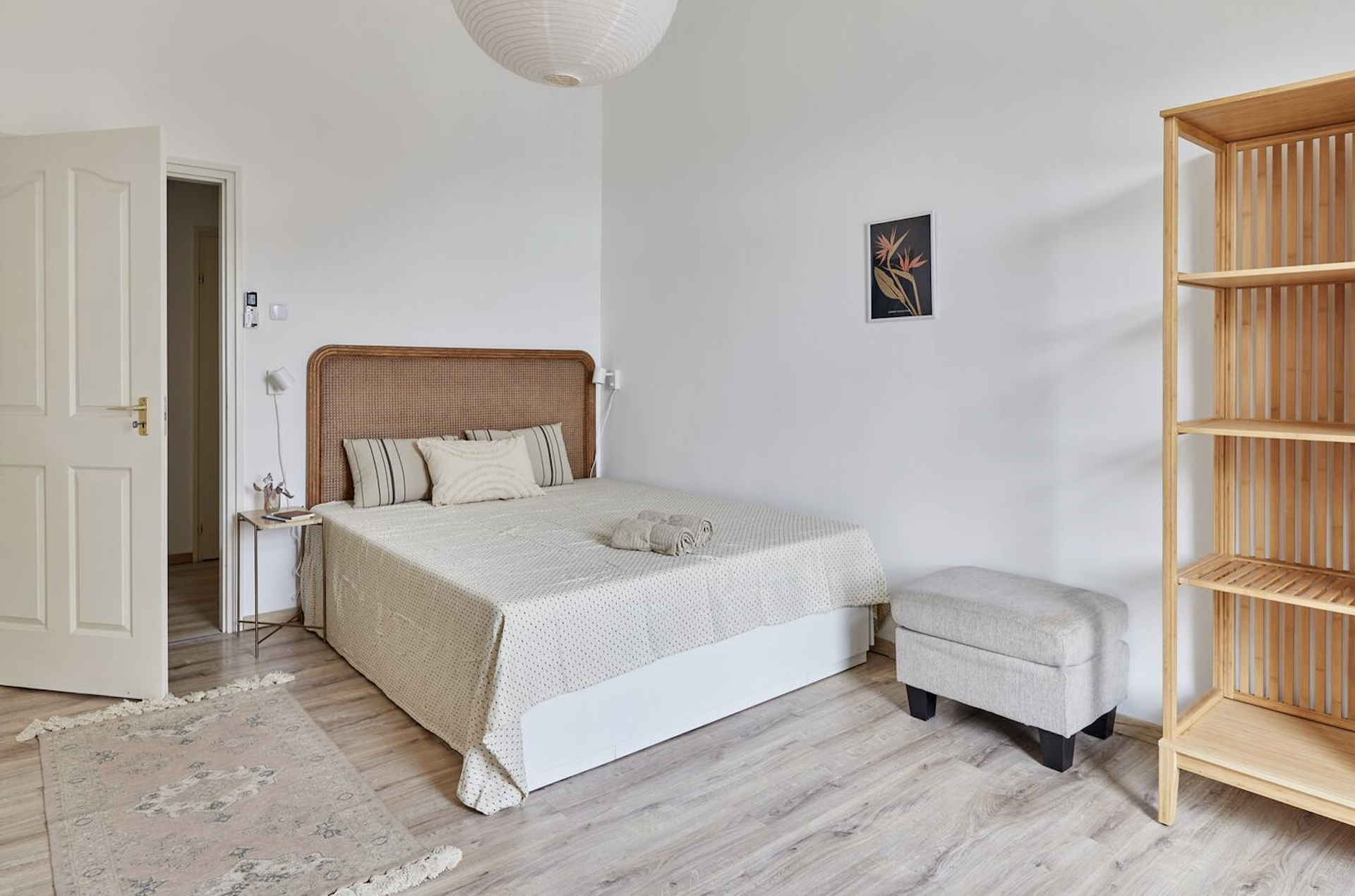 Bright bedroom with rattan headboard