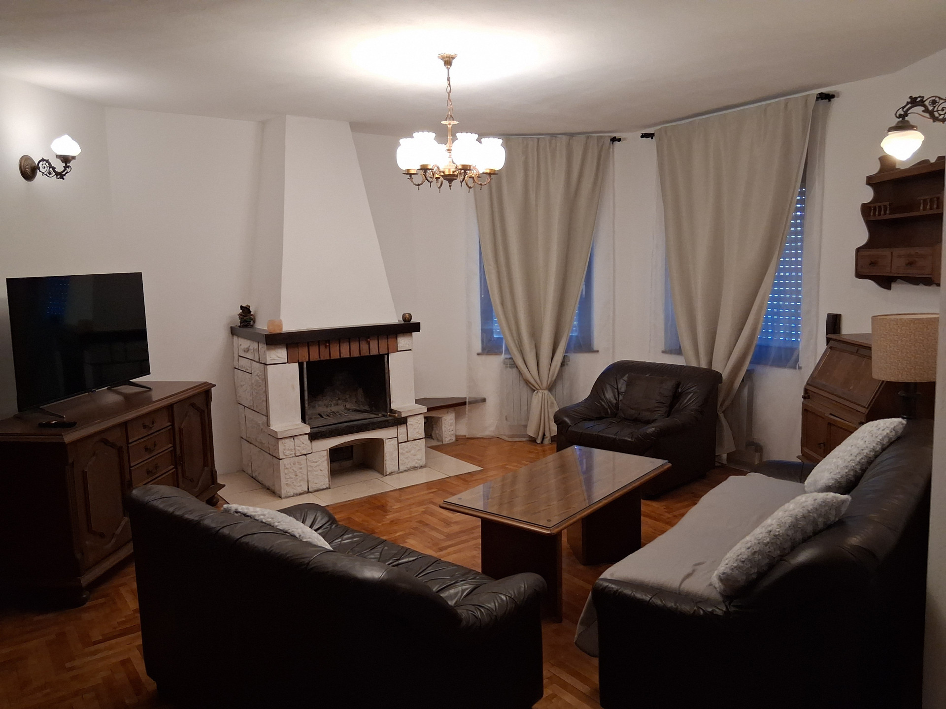 Living room with fireplace and sofas