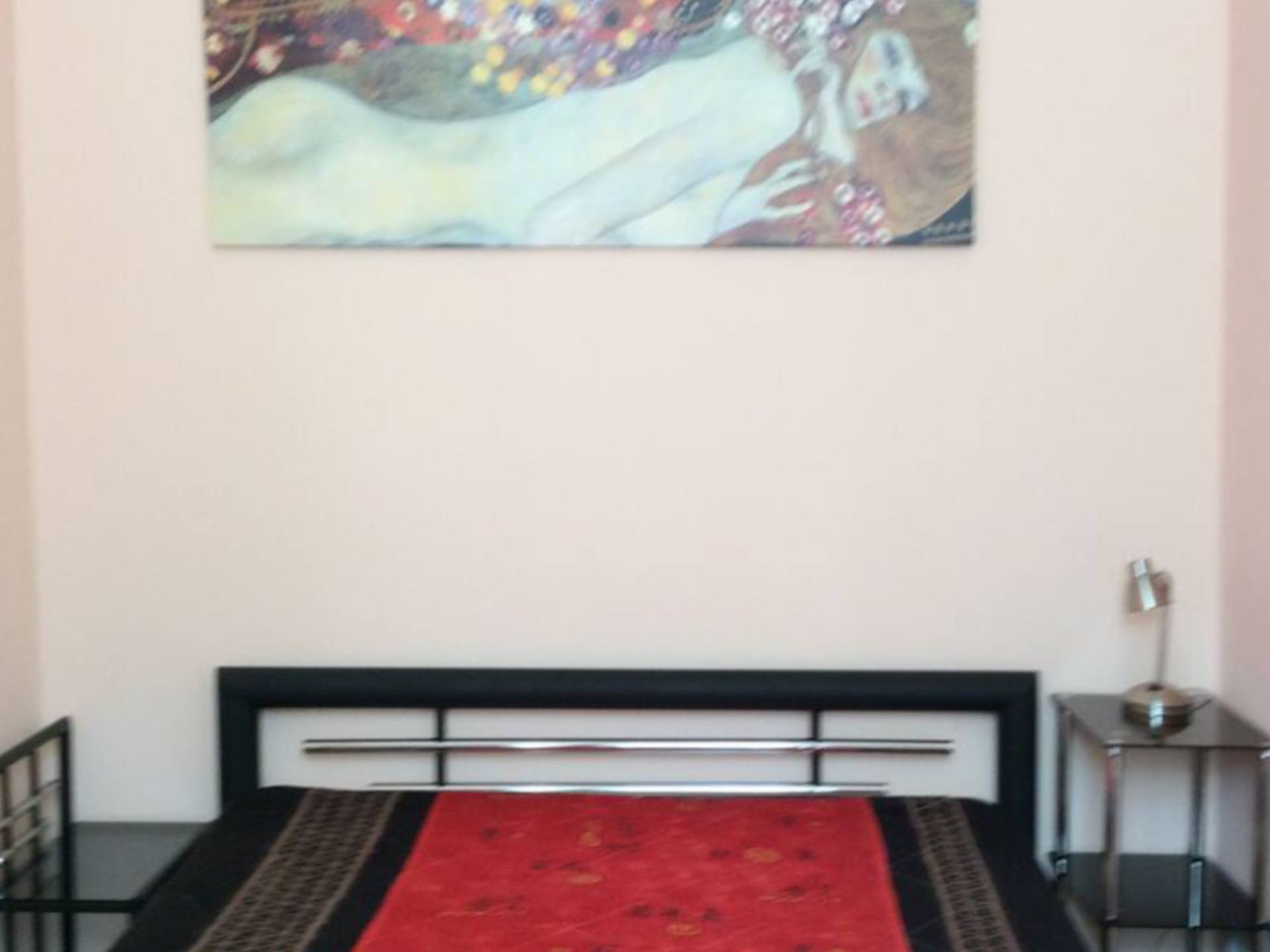 Bedroom with double bed artwork