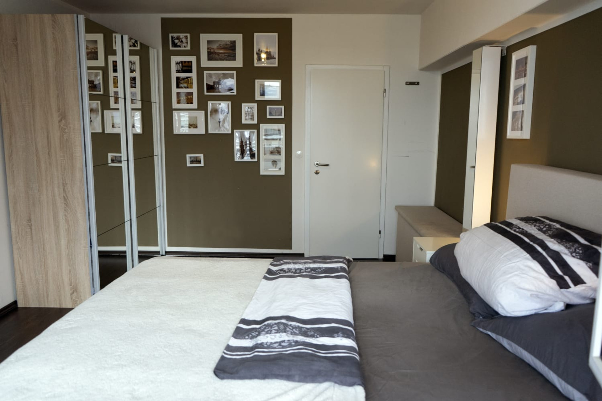 Bedroom with framed photos