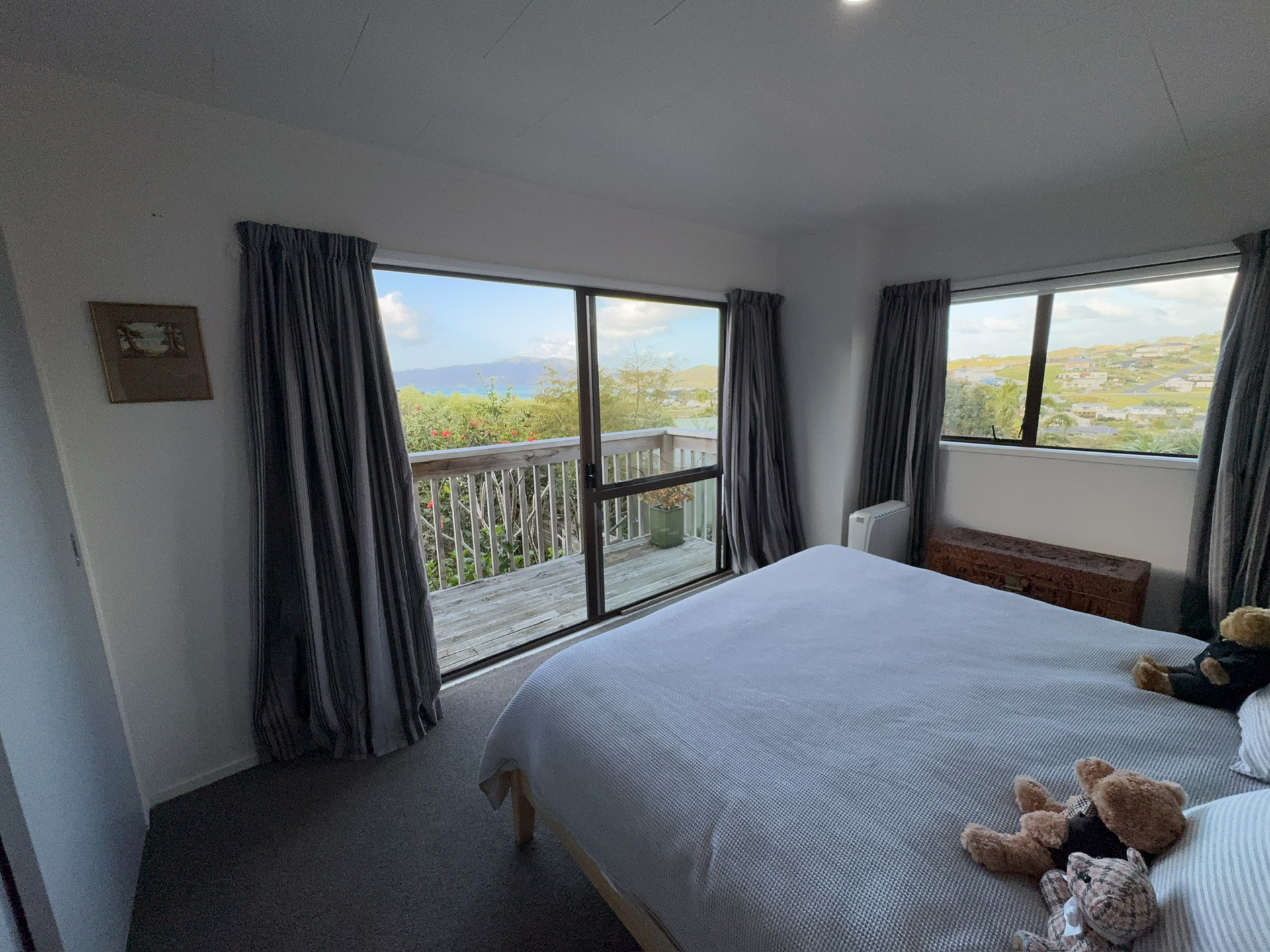 Main bedroom with deck and views