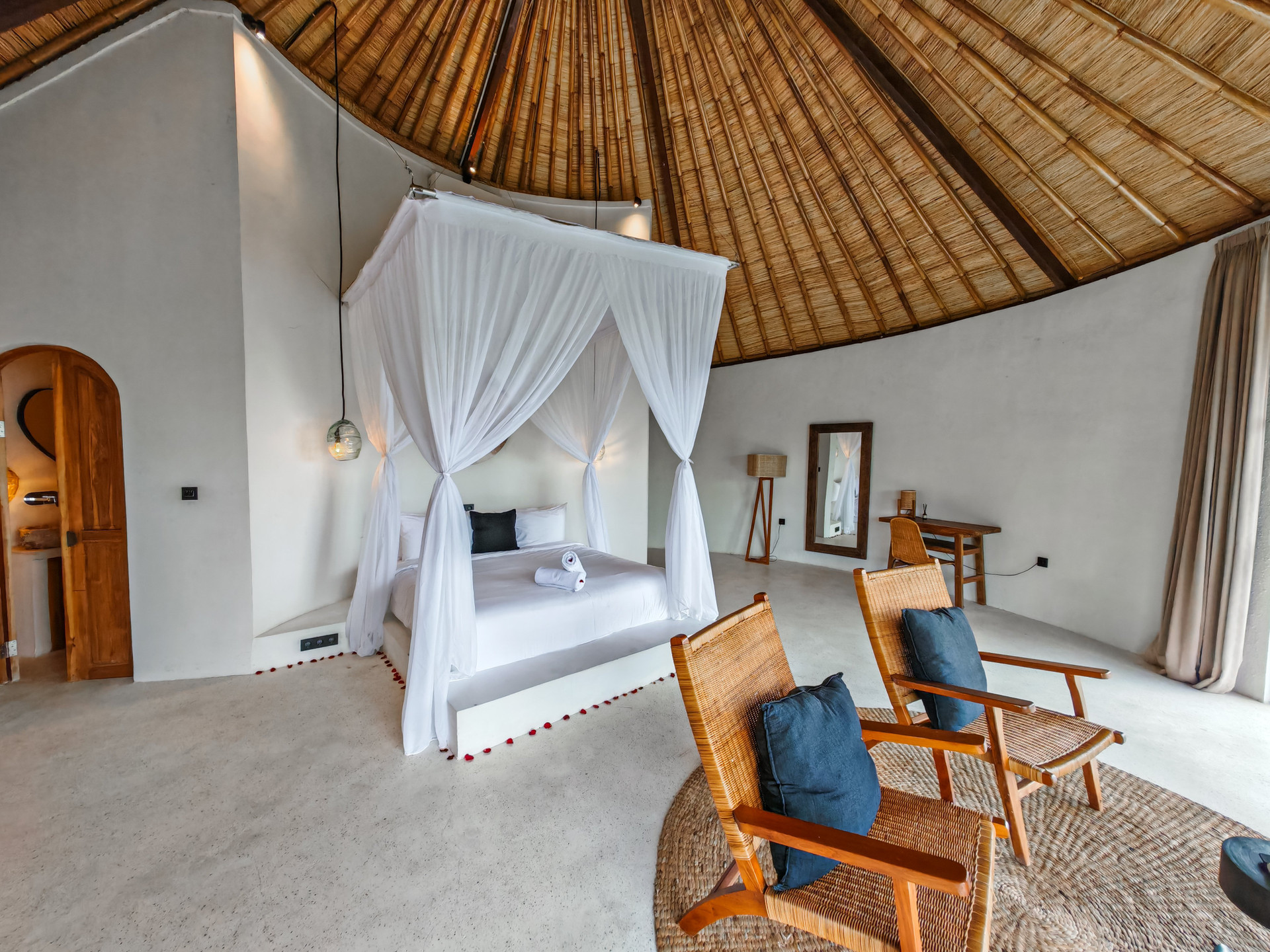 Bedroom canopy bed thatched ceiling