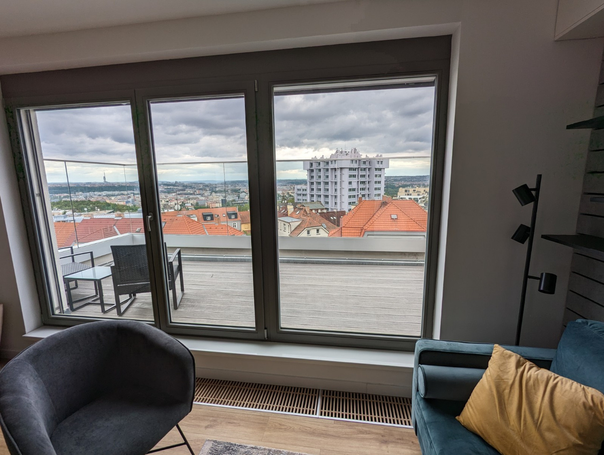 Living Room with first balcony overlooking the city. Amazing views during the day and at night!