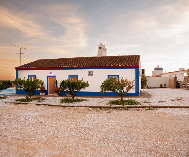 Whitewashed house at sunset