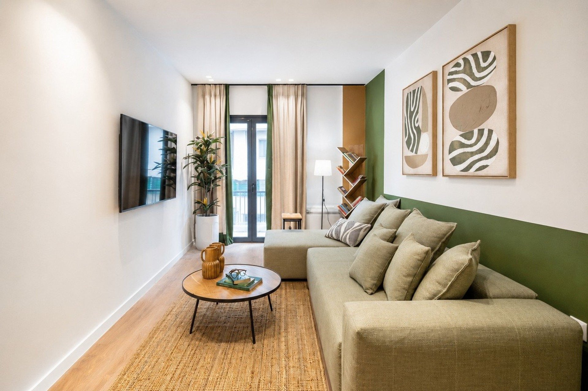 Living room with green sofa