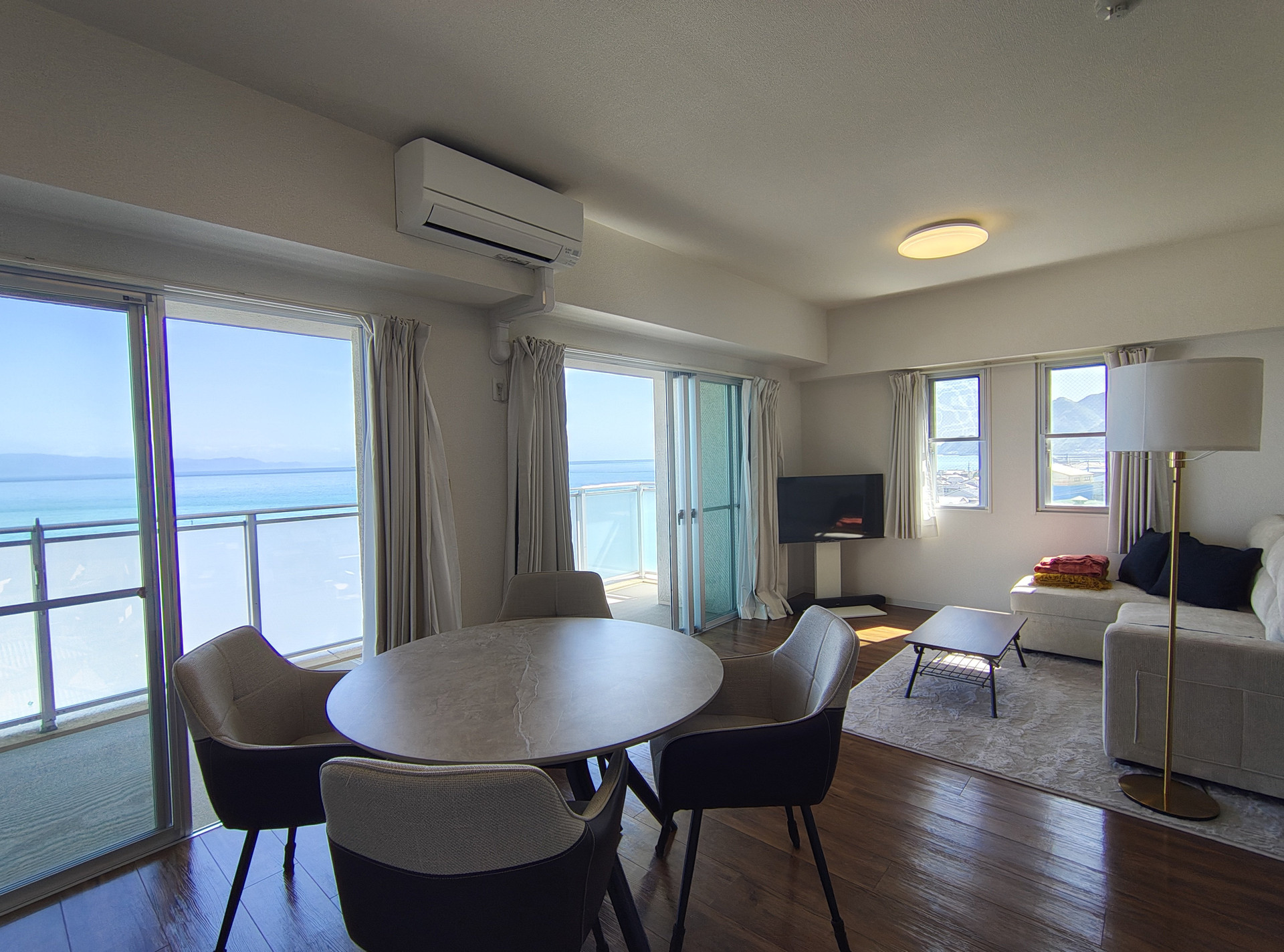 Sun-drenched living area with panoramic Pacific views.