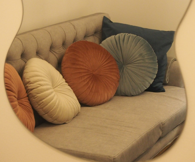 Mirror reflecting sofa pillows