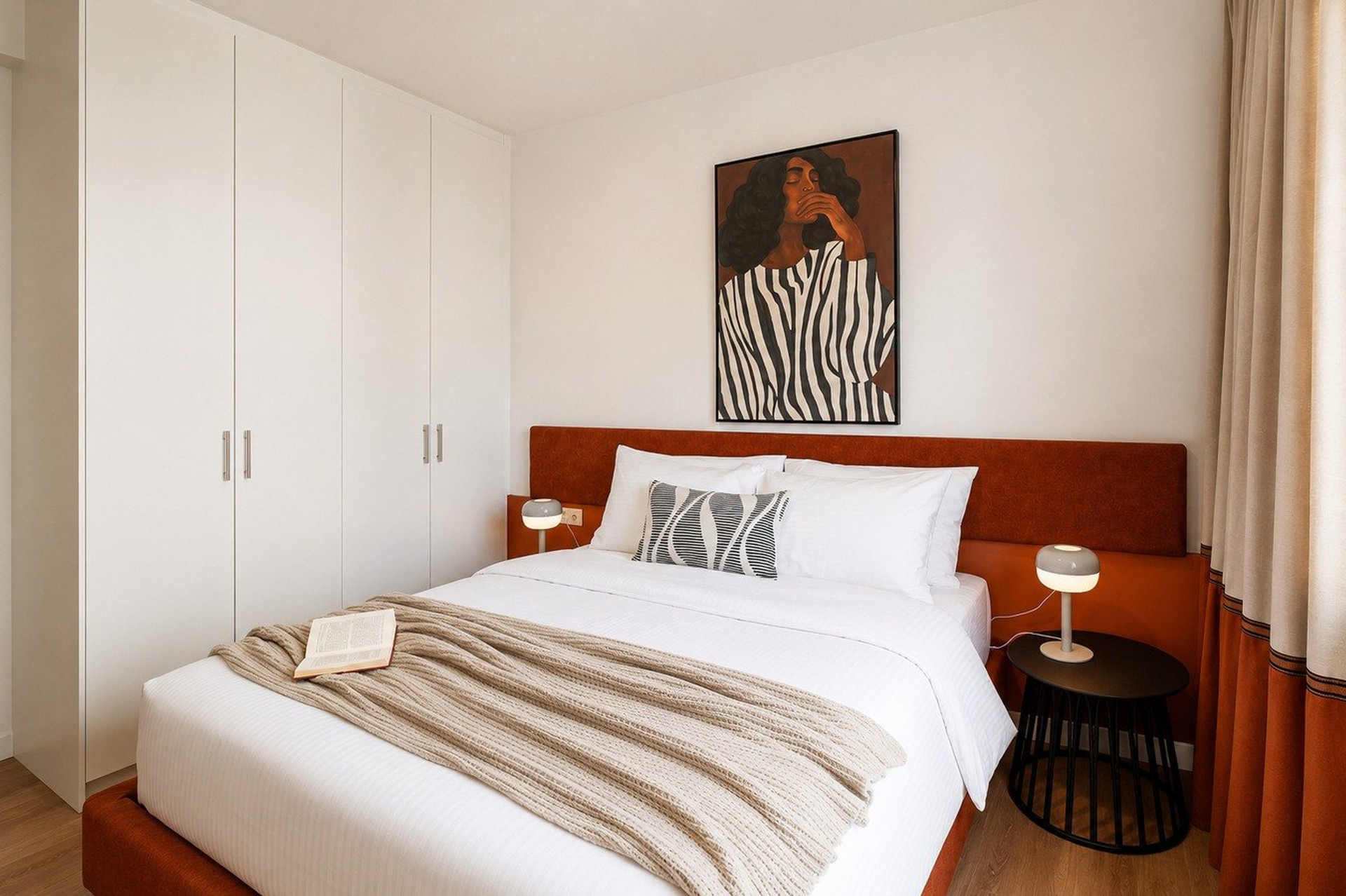 Bedroom with artistic wall portrait