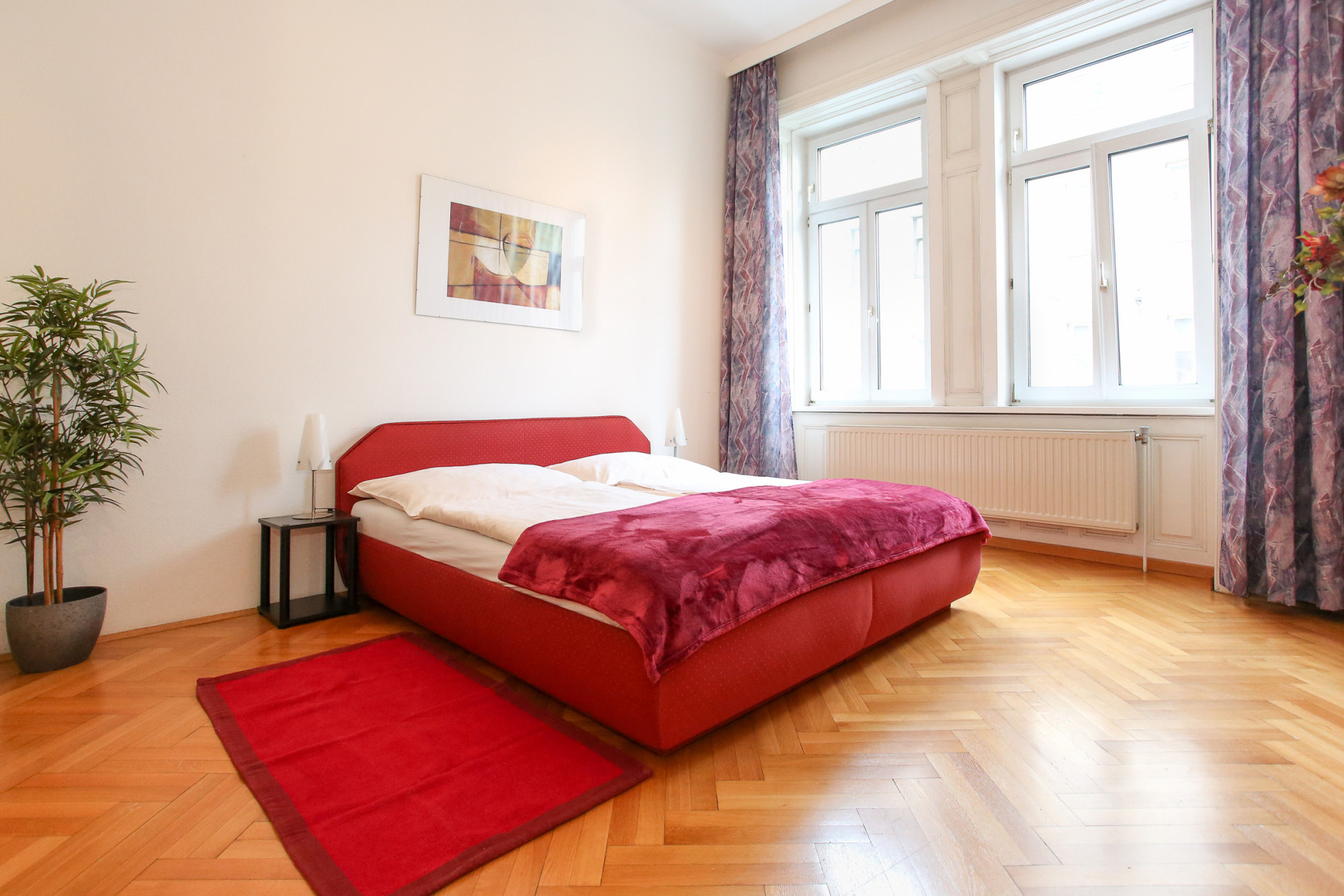 Sleeping room with a large bed for two