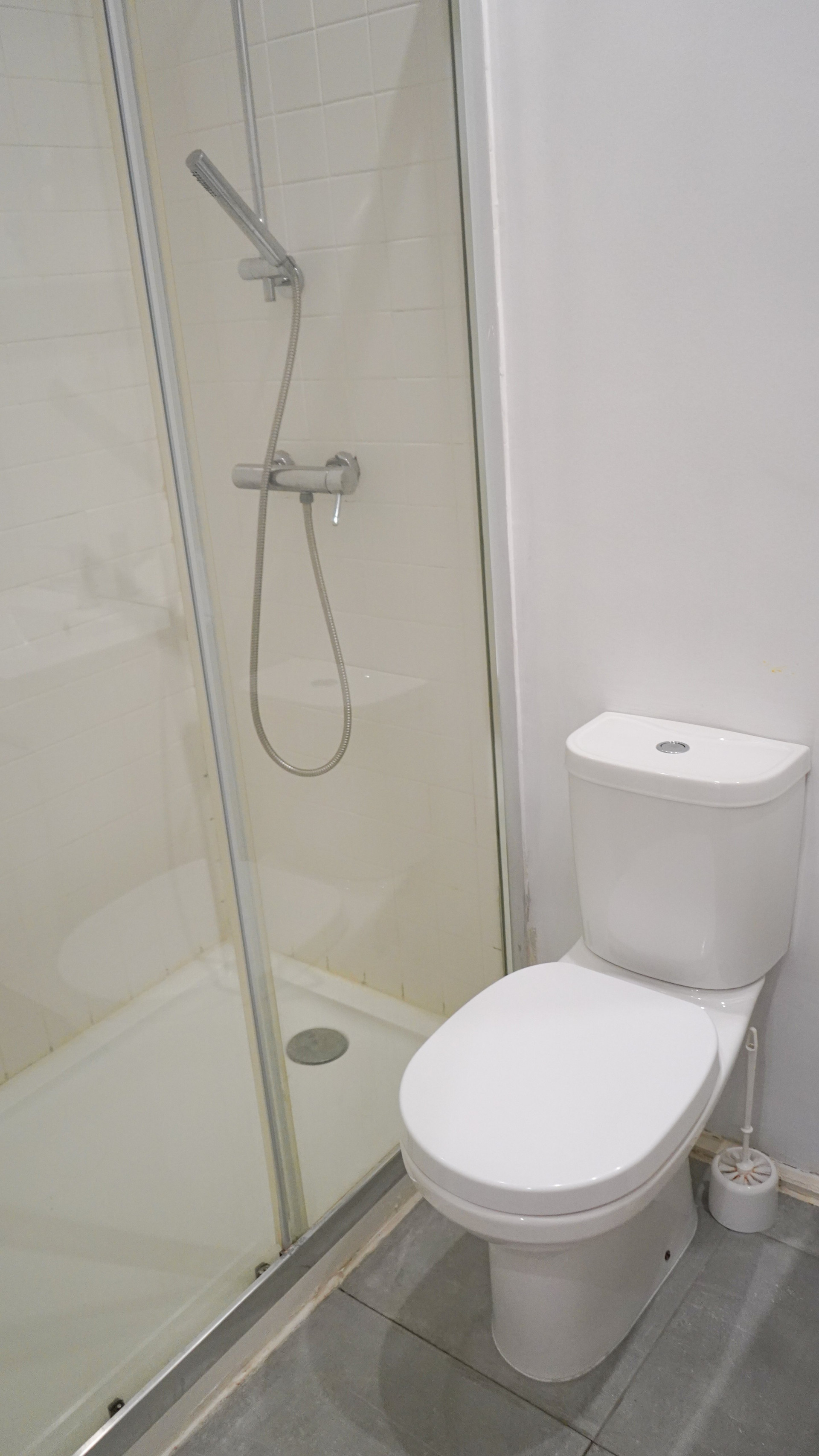 Bathroom shower toilet white tiles