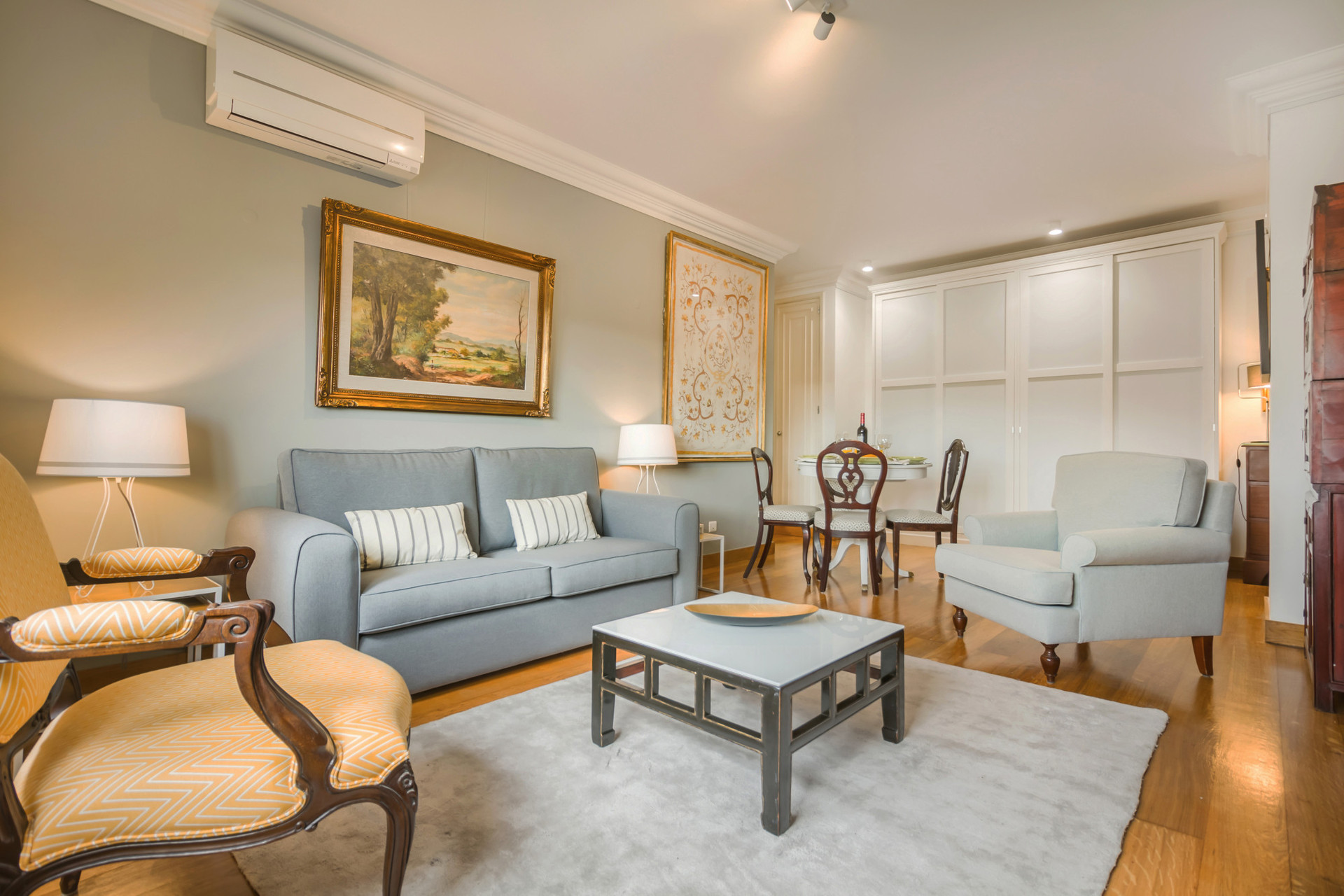 Living Room with TV, Sofa and Dining Table