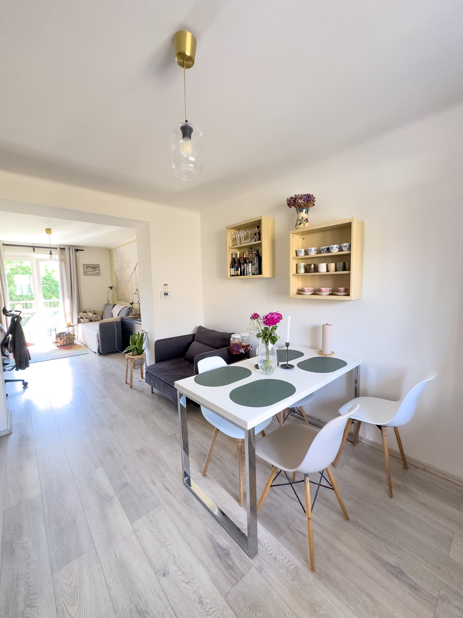 Dining area with sofa beyond