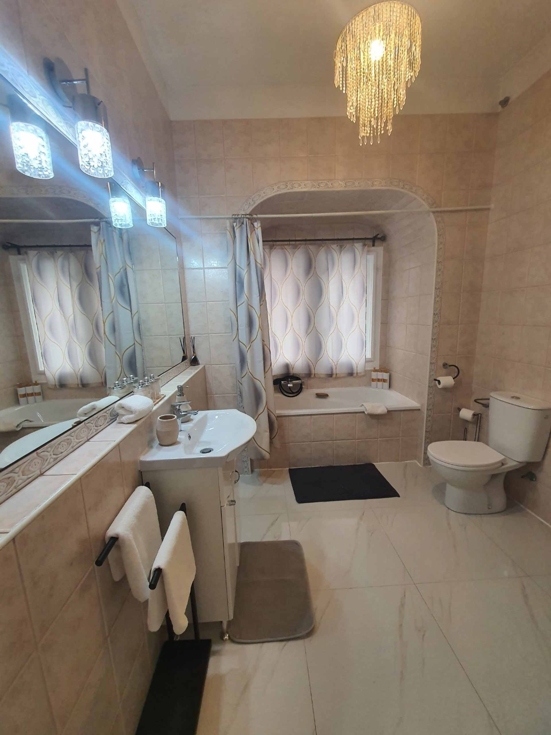 Bathroom with bathtub and vanity