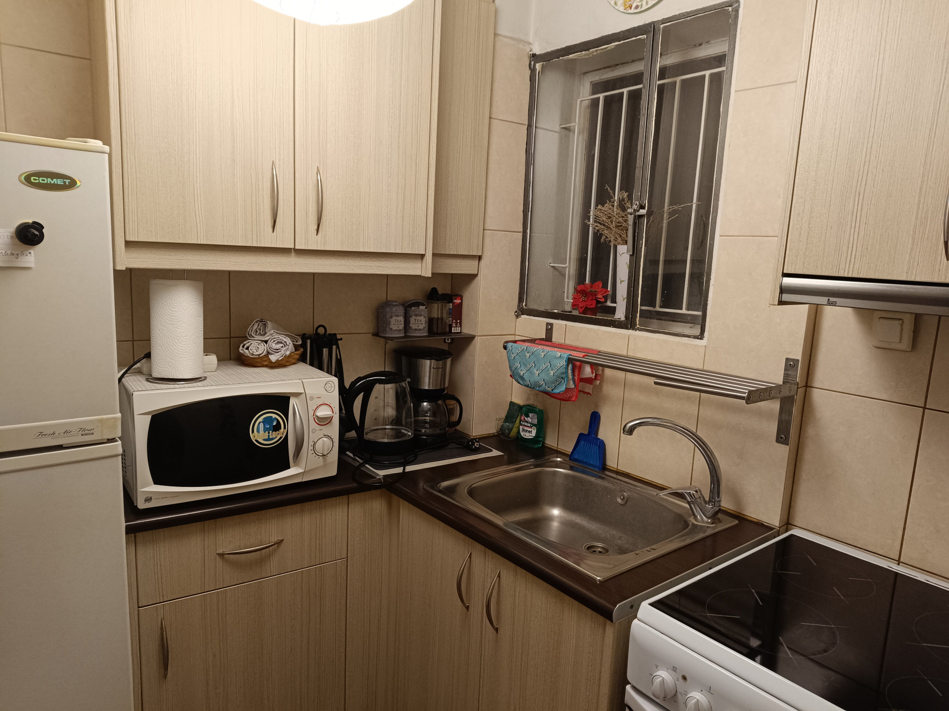 Compact kitchen with sink and stove