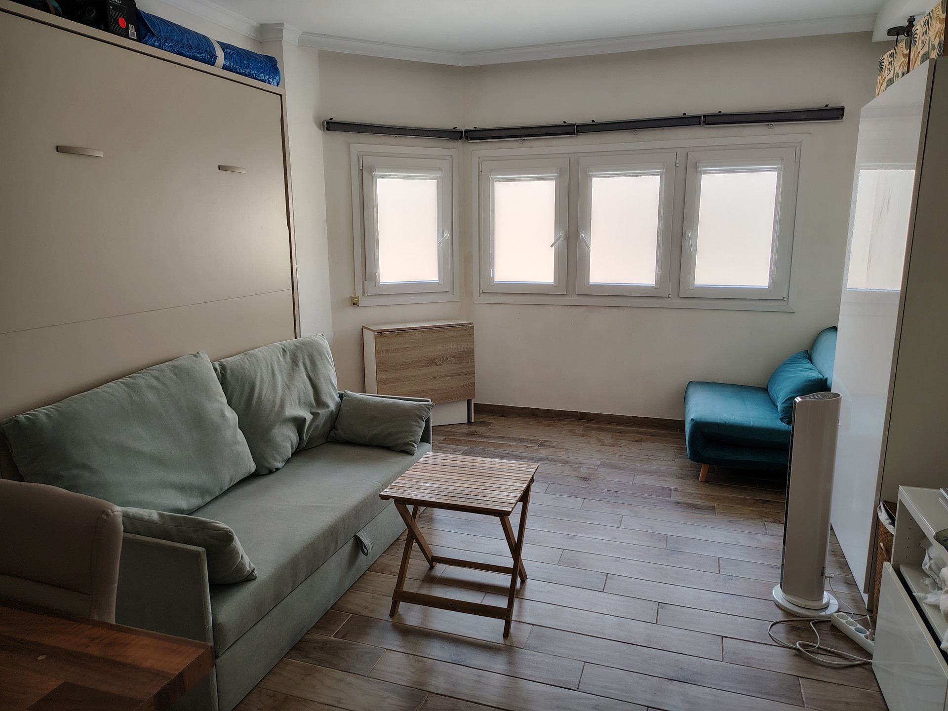 Living room with sofas and windows