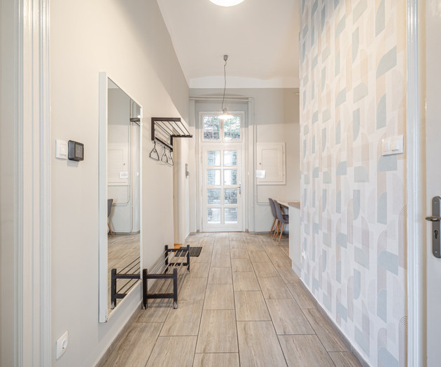 Hallway with mirror and wallpaper