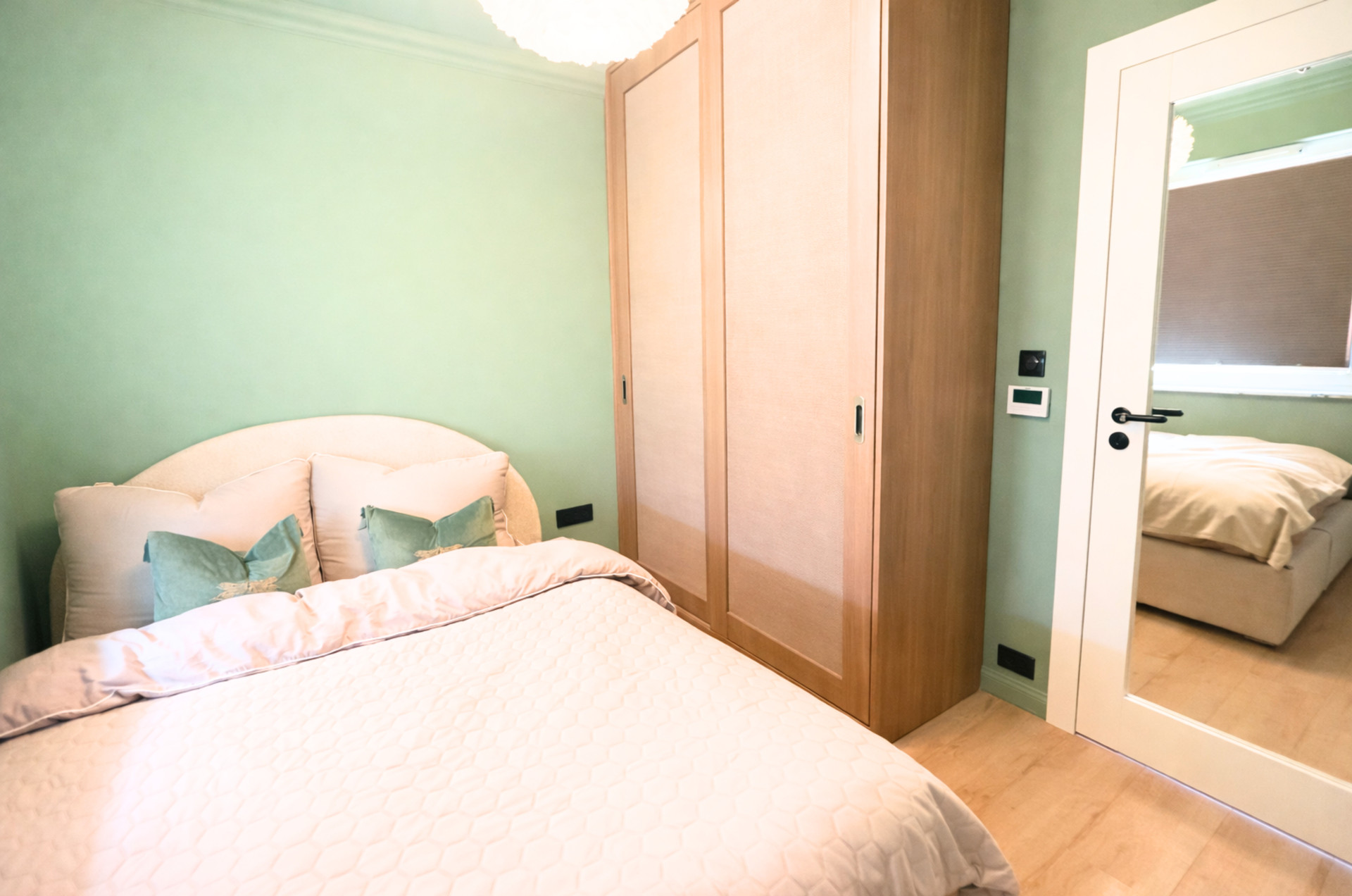 Bedroom with wardrobe and mirror