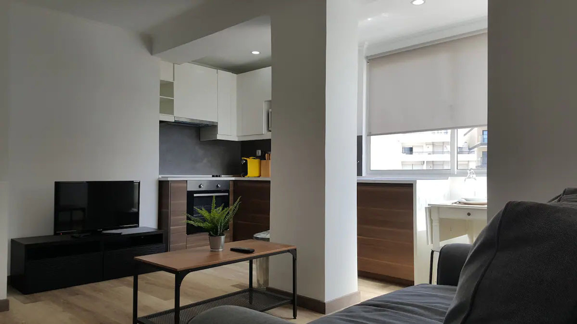 Living room with kitchen and sofa