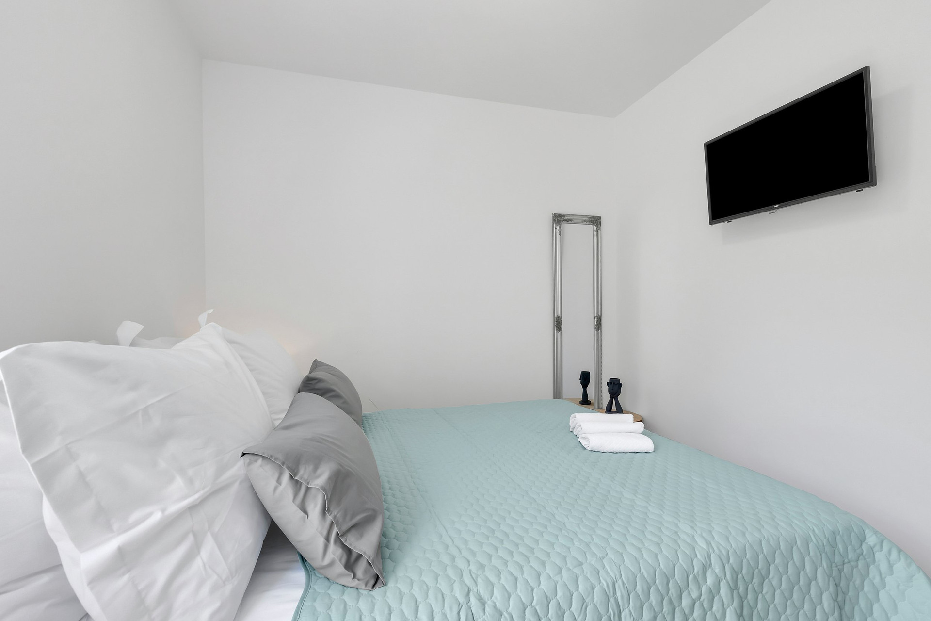 Bedroom with teal bedspread