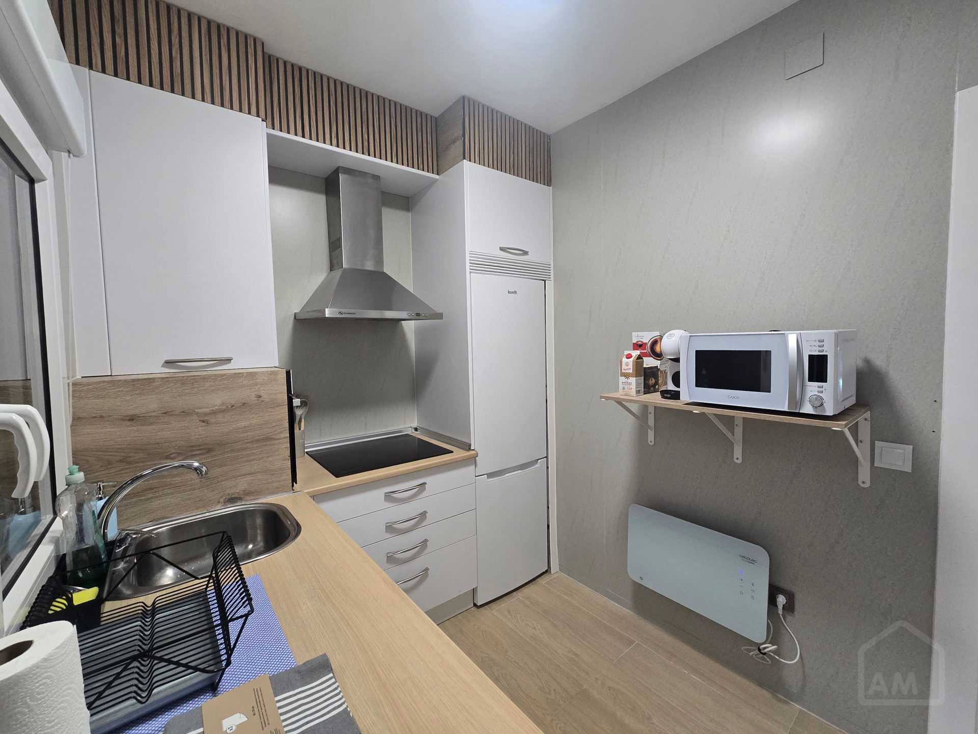Kitchen with fridge and microwave