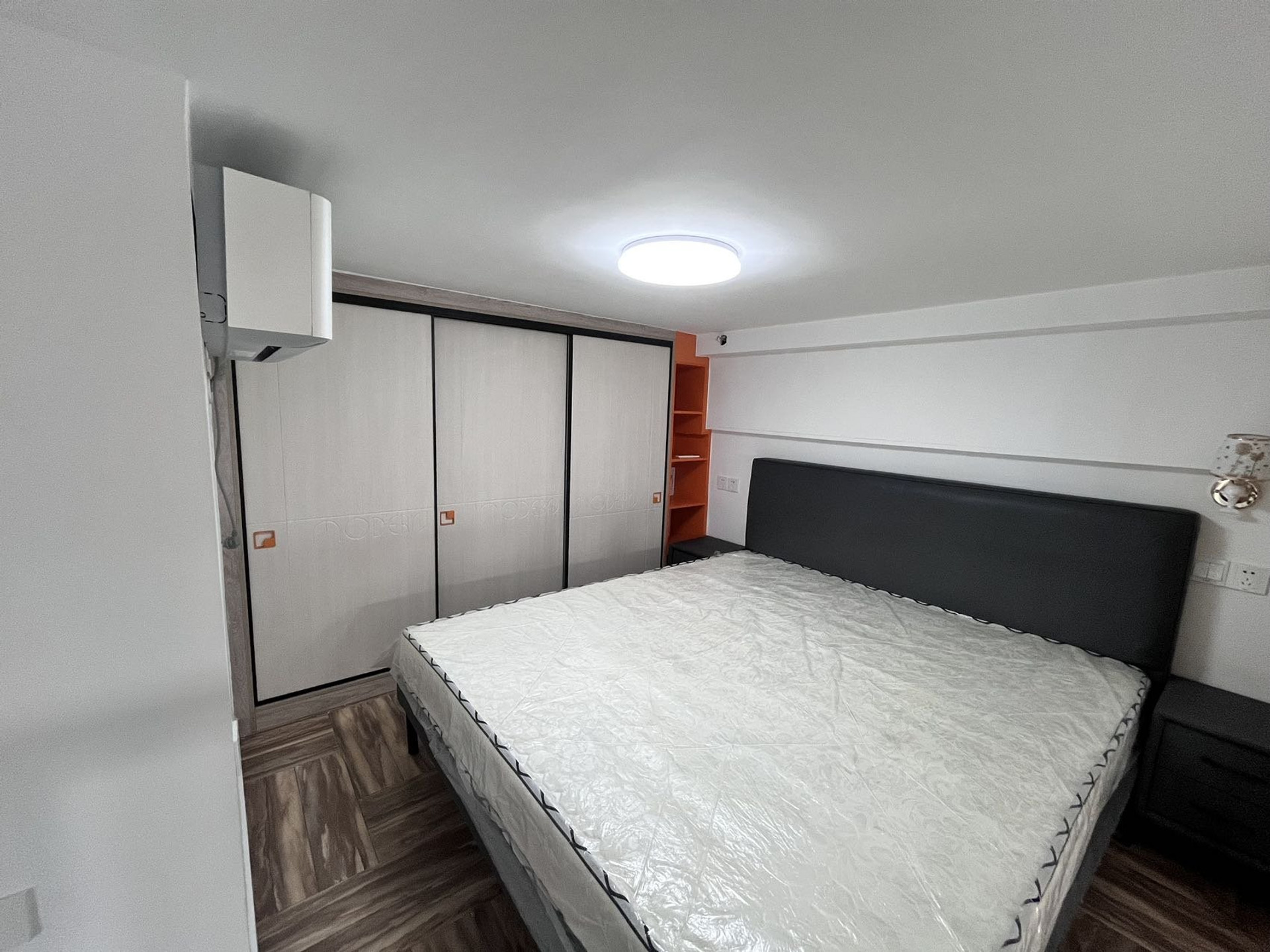 Bedroom with wardrobe and AC