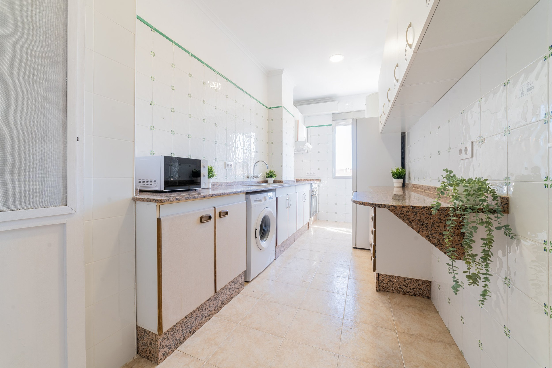 Bright kitchen with washing machine