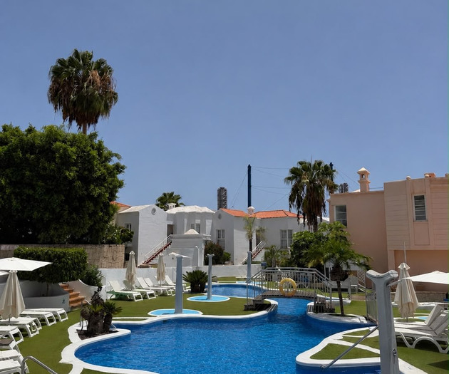 Resort pool with loungers