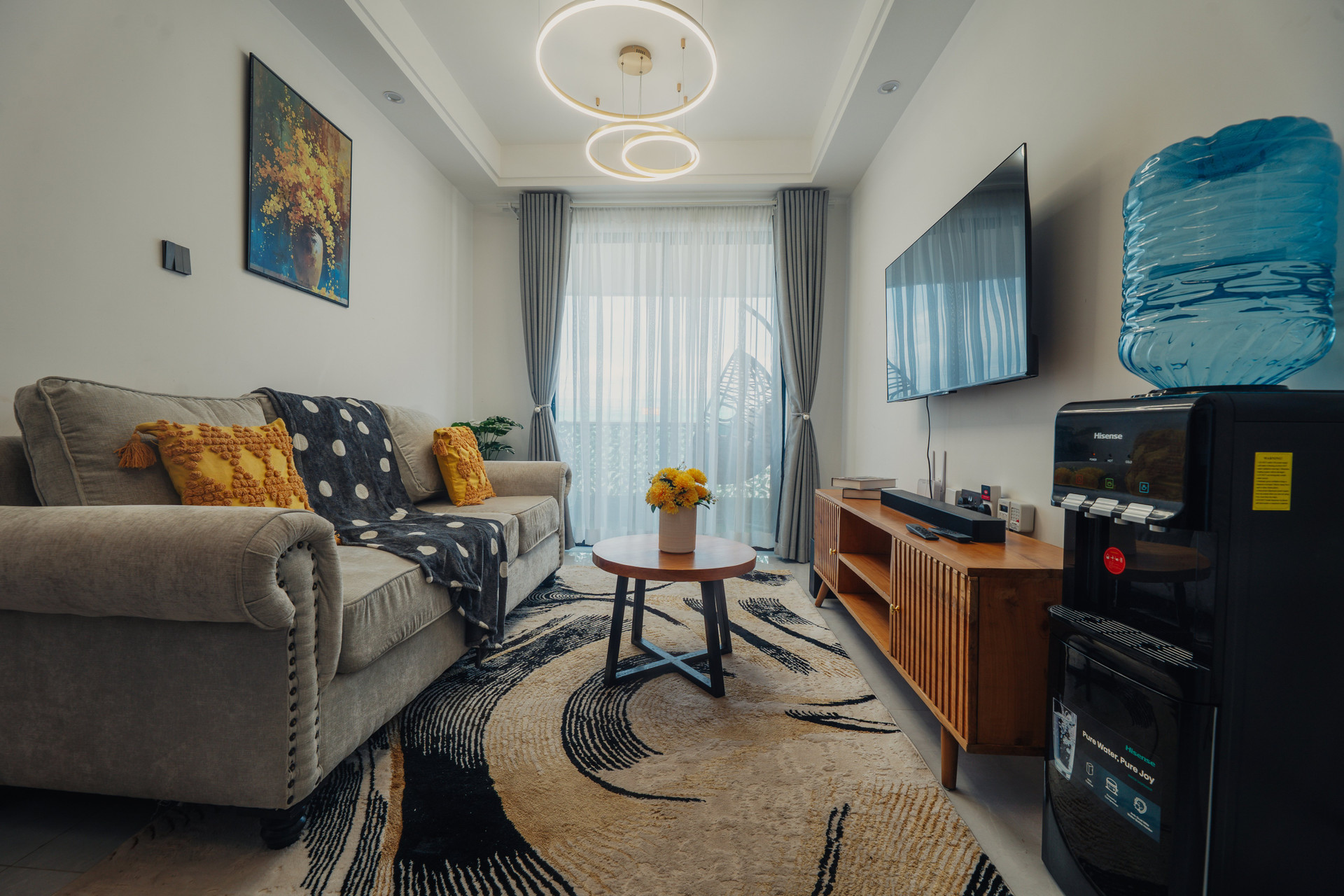 Bright living room with sofa TV